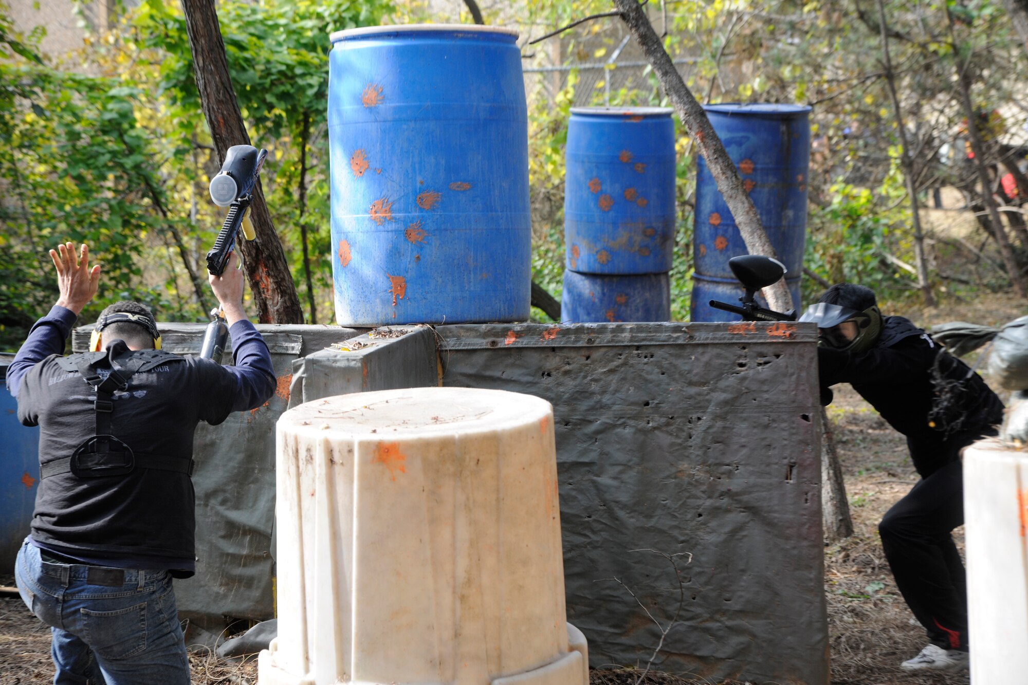 Capt. Michael Harvey, 8th Comptroller Squadron financial analysts flight commander, raises his hands as he is shot by a Republic of Korea Air Force member during a game of paintball during the Korean-American Sports Day at Kunsan Air Base, Republic of Korea, Nov. 2, 2011. The day had various events including softball, tug-of-war and paintball. (U.S. Air Force photo by Staff Sgt. Rasheen Douglas/Released)