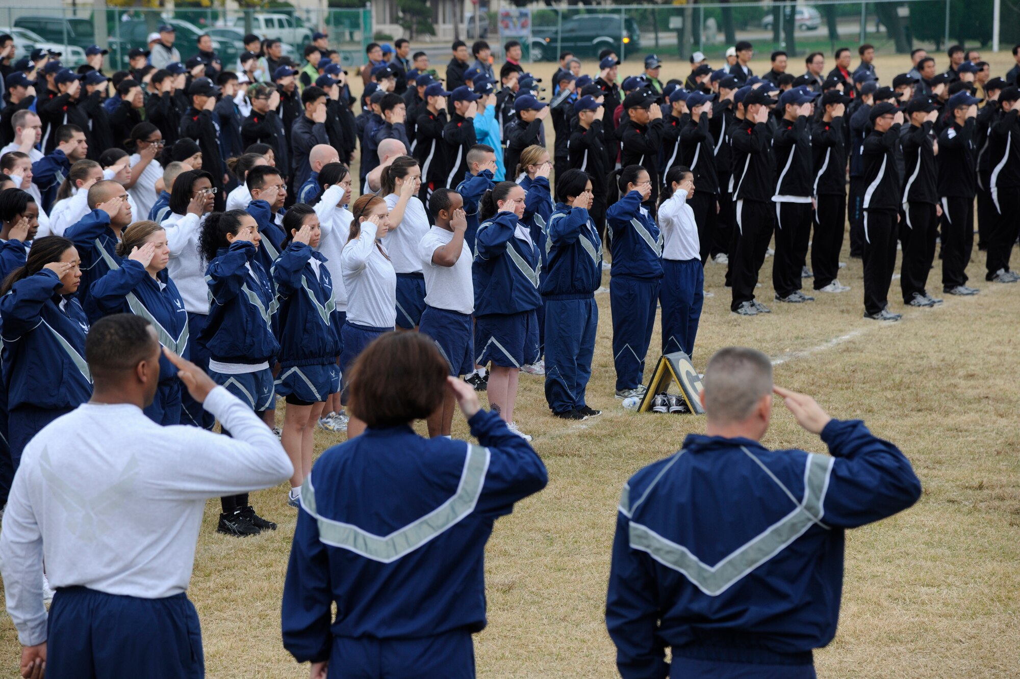 Airmen from the 8th Fighter Wing line up alongside Republic of Korea Air Force members from the 38th Fighter Group during the opening ceremony for the Korean-American Sports Day at Kunsan Air Base, Republic of Korea, Nov. 2, 2011. The day had various events including softball, tug-of-war and paintball. (U.S. Air Force photo by Staff Sgt. Rasheen Douglas/Released) 