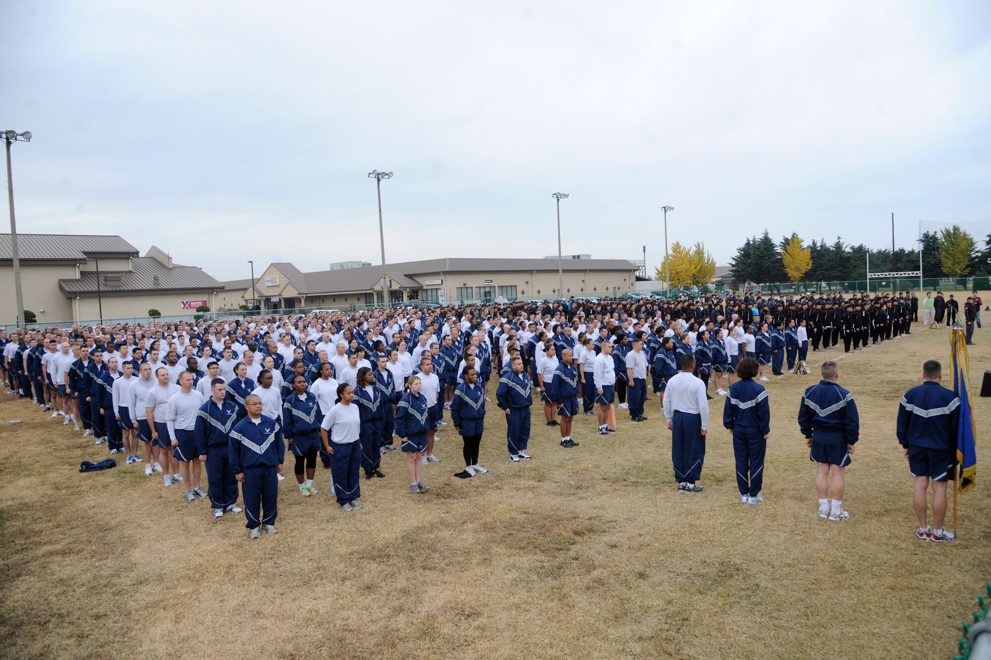 Airmen from the 8th Fighter Wing line up alongside Republic of Korea Air Force members from the 38th Fighter Group during the opening ceremony for the Korean-American Sports Day at Kunsan Air Base, Republic of Korea, Nov. 2, 2011. The day had various events including softball, tug-of-war and paintball. (U.S. Air Force photo by Staff Sgt. Rasheen Douglas/Released)