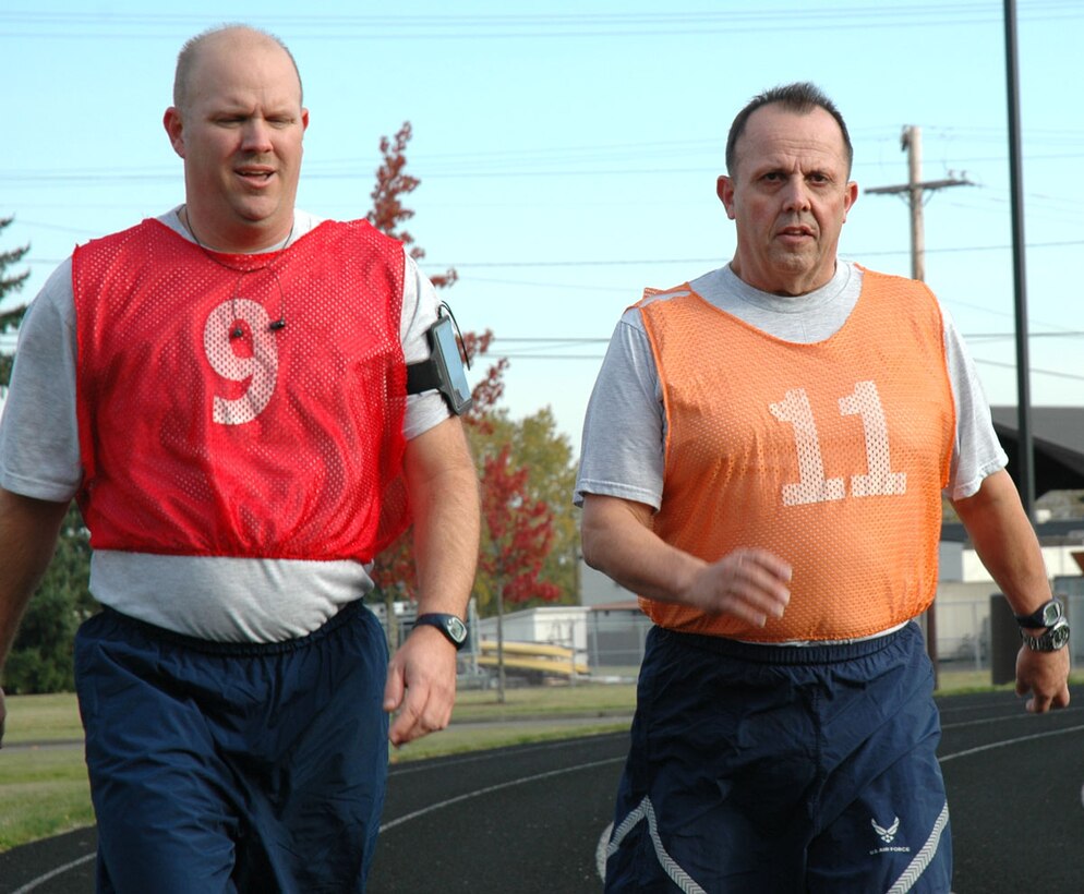 Master Sgt. Dave Axtell (right), and Tech Sgt. Allen Ellzey, Reservists with the 446th Aircraft Maintenance Squadron, take part in a fitness test during a unit training assembly at McChord Field, Wash. on Nov. 6, 2011.  With the help of the U.S. Department of Justice, Sergeant Axtell recently won a lawsuit against his former civilian employer for illegal termination after the company violated his reemployment rights following a four-year activation. (U.S. Air Force photo/Staff Sgt. Grant Saylor)