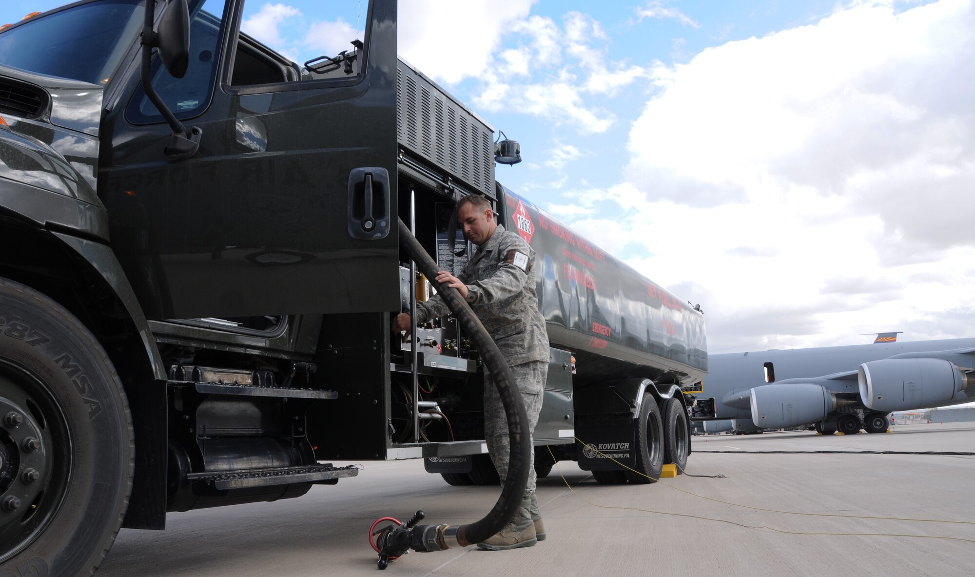 Staff Sgt. Donovan Walden, 161st Logistics Readiness Group fuels technician, wraps up a hose on a fuel truck as part of a routine inspection during an aircraft generation exercise, Phoenix, Nov. 5, 2011. In order to maintain safety on the flightline, these six thousand gallon fuel trucks are inspected daily for leaks and cracks in the pipes. (U.S. Air Force Photo by Staff Sgt. Courtney Enos/Released)