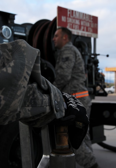 Staff Sgt. Donovan Walden, 161st Logistics Readiness Group fuels technician, monitors the gauges on a fuel truck as part of a routine inspection during an aircraft generation exercise, Phoenix, Nov. 5, 2011. In order to maintain safety on the flightline, these six thousand gallon fuel trucks are inspected daily for leaks and cracks in the pipes. (U.S. Air Force Photo by Staff Sgt. Courtney Enos/Released)