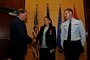 Brig. Gen. Wayne E. Lee presents the Legion of Merit award in honor of the late Col. Bruce C. Evans to his wife, Mrs. Connie Evans, and his son, 1st Lt. Benjamin Evans.  Colonel Evans was awarded the Legion of Merit posthumously for exceptionally meritorious conduct as the state staff Judge Advocate with the Utah Air National Guard Headquarters. (Air Force photo by TSgt Jeremy Giacoletto-Stegall)