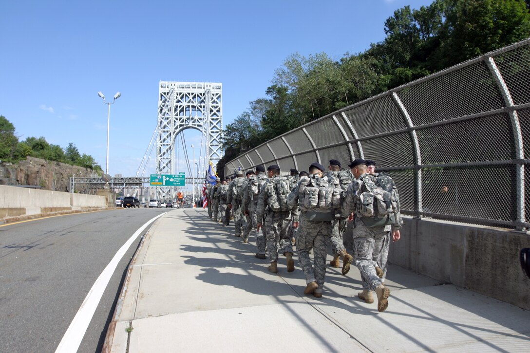 Security forces members from the 108th Contingency Response Group and the 108th Wing, New Jersey Air National Guard, participated on the 9-11 Ruck March to Remember event on Sept. 10. The SFS teams marched more than 30 miles along route 80 and 46 from Parsippany, N.J. to Time Square in New York City. The 9/11 Ruck March to Remember began eight months ago at Lackland Air Force Base, Texas, and it ends at Ground Zero in New York. This march is in remembrance of defenders who were killed or injured in the 10 years since the terrorist attacks on 9/11. (U.S. Air Force photo by Staff Sgt. Armando Vasquez, 108th WG/PA)