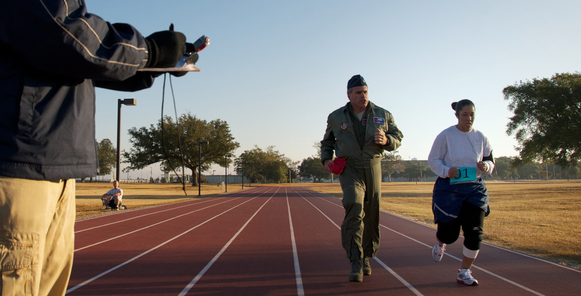 Master Sgt. Rachelle Johnson narrows in on the finish line of the 1.5 mile run during the AF physical fitness test Nov. 5, 2012.
Johnson, who serves as Chief of the Commander Support Staff at the 403rd Force Support Squadron, had recently come off a two year medical profile that prevented her from the type of training that she needed to pass the AF PFT. 
A challenge to its own, she also knew the bar had been raised in the world of AF physical fitness. 
Nevertheless, she hit the ground running three days a week on the track, and also seeking help with her exercise regime.
"Fortunately, I had support from everyone, and A1C Aaron Cole from the 345th even volunteered his own time to help me," said Johnson, "I couldn't have done it without them."
Johnson passed the PFT. (U.S. Air Force photo by Capt. J. Justin Pearce)
