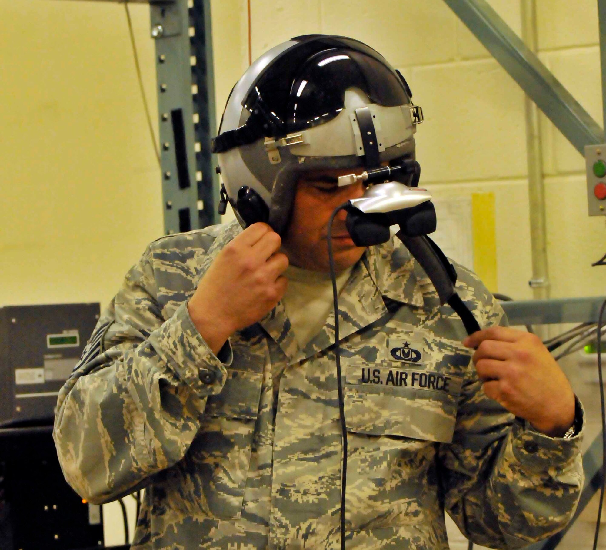 PATRICK AIR FORCE BASE, Fla. - Tech. Sgt. Xavier Coronel, aircrew flight equipment specialist, 920th Operation Support Squadron, prepares to test out the parachute simulator. Pararescueman use the simulator to prepare themselves for when they deploy their parachutes. (U.S. Air Force Photo/Capt. Ryan Liss)