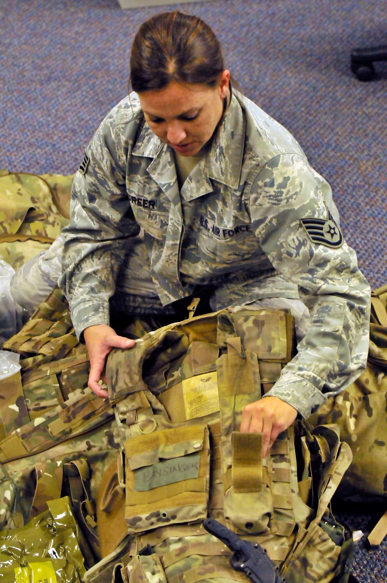 PATRICK AIR FORCE BASE, Fla. - Staff Sgt. Stacie Greer, aircrew flight equipment specialist, 920th Operations Support Squadron, packs a pararescueman's bag in preparation for deployment. Whether it's an air show, deployment, or day-to-day operations, AFE specialists are responsible for keeping equipment ready to go. (U.S. Air Force Photo/Capt. Ryan Liss)