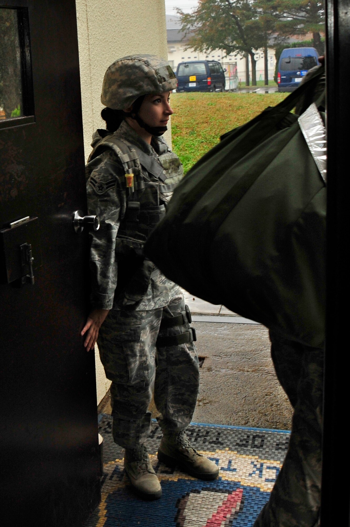 MISAWA AIR BASE, Japan – U.S. Air Force Airman 1st Class Jessica Lee, 35th Security Forces Squadron, controls access to the Emergency Operations Center, the hub for command and control activities, during an operational readiness exercise here Nov. 6. The 35th Fighter Wing is currently going through an ORE in preparation for an operational readiness inspection in December. (U.S. Air Force photo/Staff Sgt. Nathan Lipscomb)