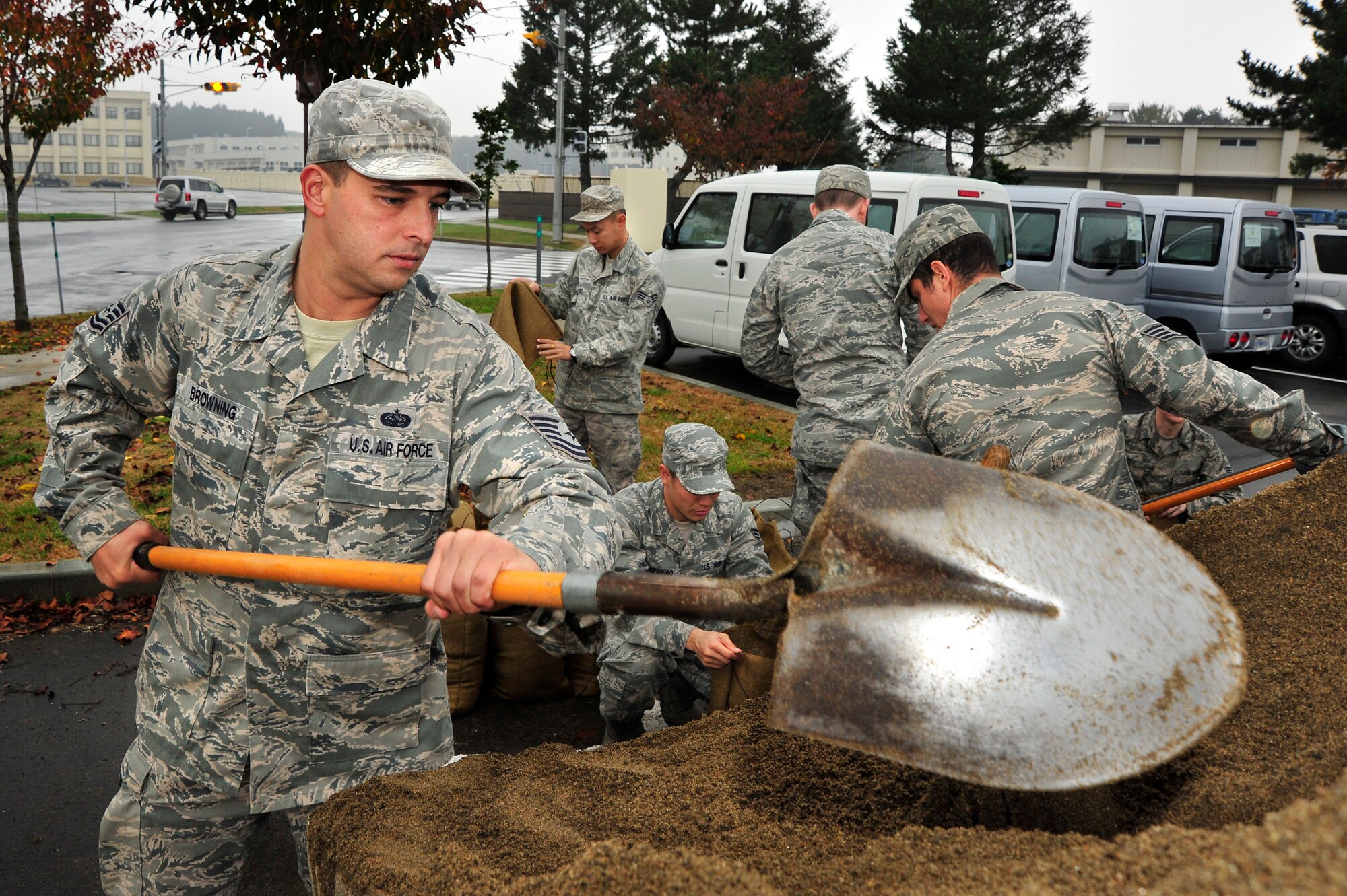 MISAWA AIR BASE, Japan – U.S. Air Force Tech. Sgt. Brian Browning, 35th Communications Squadron, shovels sand during an operational readiness exercise here Nov. 6. Browning and his team shoveled the sand into sandbags in order to protect their buildings in case of simulated attack. The 35th Fighter Wing is currently going through an ORE in preparation for an operational readiness inspection in December. (U.S. Air Force photo/Staff Sgt. Nathan Lipscomb)