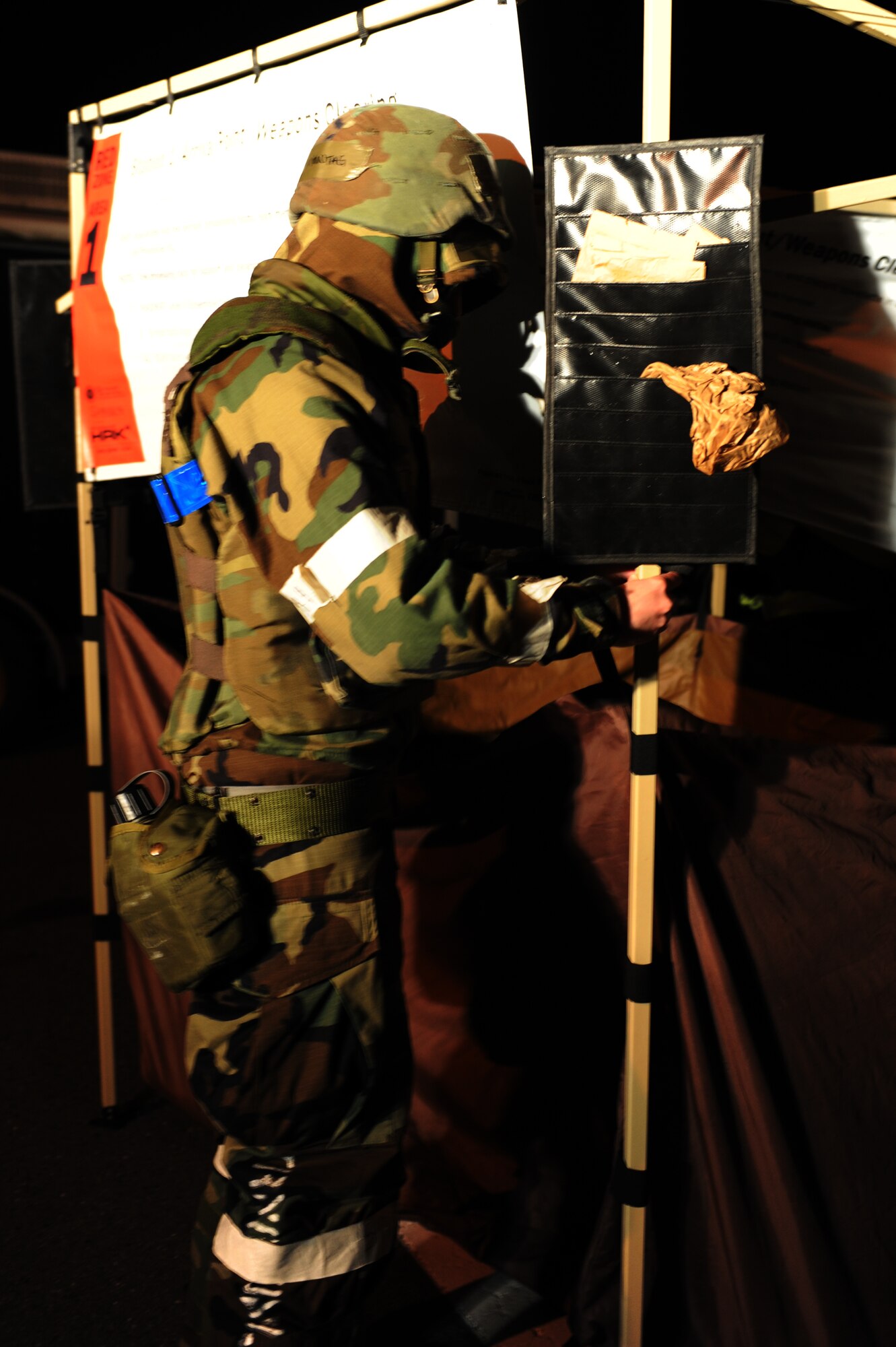 MISAWA AIR BASE, Japan – Airman 1st Class Kaitlin Montag, 35th Medical Support Squadron, helps set up a contamination control area during an operational readiness exercise here Nov. 8. The 35th Fighter Wing is preparing for an operational readiness inspection in December. (U.S. Air Force photo by Airman 1st Class Kia Atkins)