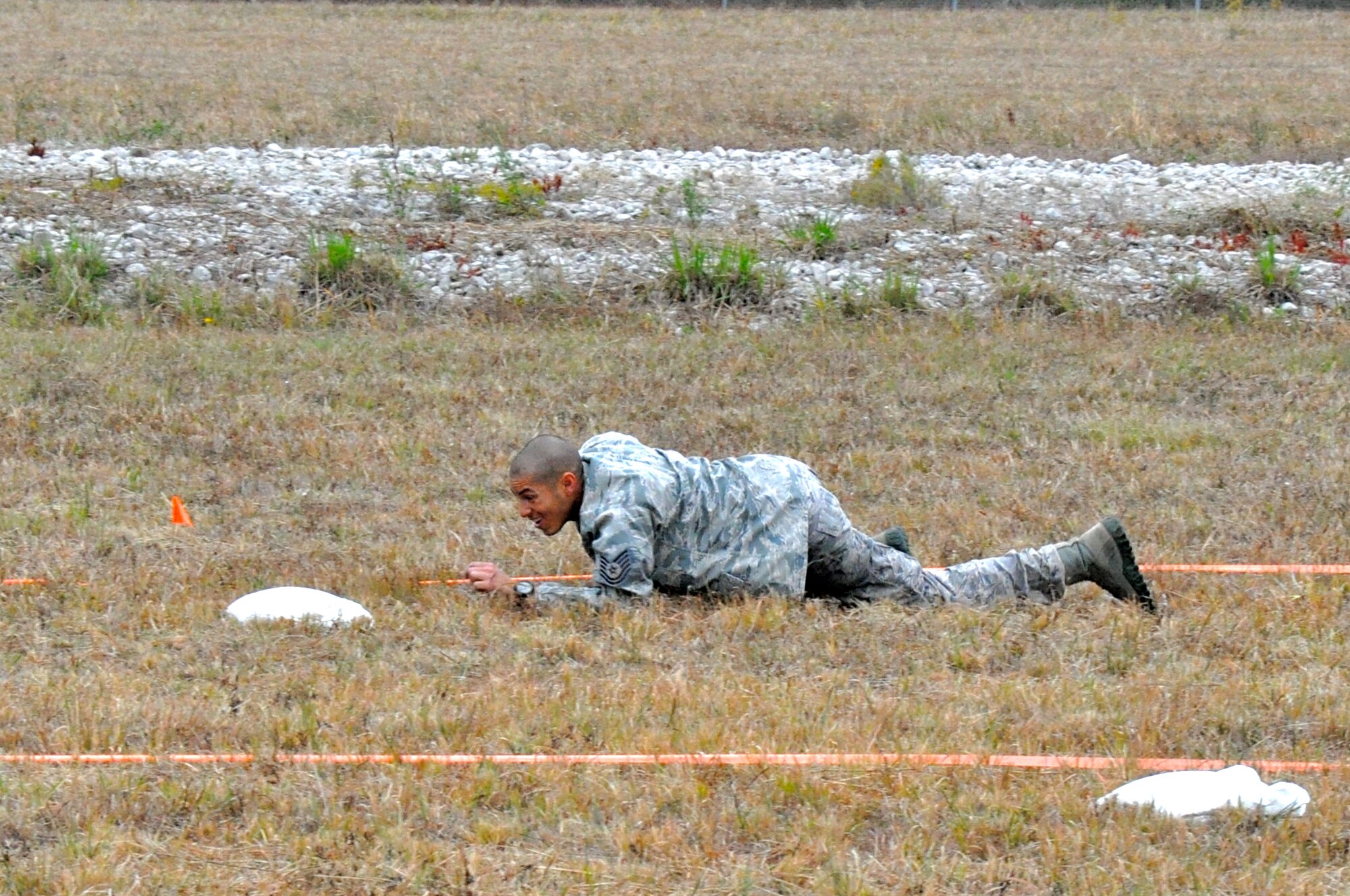 CAMP MINDEN, La. -- Tech. Sgt. Kyle Andino, 91st Security Forces Group, completes the individual movement phase of the competition, which challenged Airmen to sprint, low crawl, high crawl and carry other ‘injured Airmen’. Security forces Airmen from the 91st Missile Wing competed against other Air Force Global Strike Command security forces teams in the second annual Global Strike Challenge here, Nov. 5-7.  Each team was judged on completing various tasks during the competition to include their knowledge of tactical maneuvers as a team and as individuals, weapons familiarity, and overall job knowledge. (U.S. Air Force photo/ Airman 1st Class Jessica McConnell)