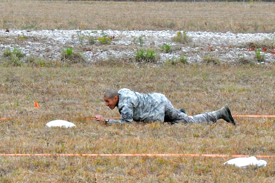 CAMP MINDEN, La. -- Tech. Sgt. Kyle Andino, 91st Security Forces Group, completes the individual movement phase of the competition, which challenged Airmen to sprint, low crawl, high crawl and carry other ‘injured Airmen’. Security forces Airmen from the 91st Missile Wing competed against other Air Force Global Strike Command security forces teams in the second annual Global Strike Challenge here, Nov. 5-7.  Each team was judged on completing various tasks during the competition to include their knowledge of tactical maneuvers as a team and as individuals, weapons familiarity, and overall job knowledge. (U.S. Air Force photo/ Airman 1st Class Jessica McConnell)