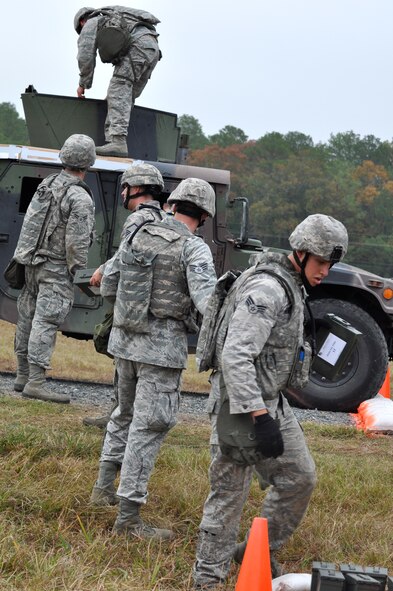 CAMP MINDEN, La. -- Security forces Airmen from the 5th Bomb Wing competed against other Air Force Global Strike Command security forces teams in the second annual Global Strike Challenge here, Nov. 5-7. Here, 5th Security Forces Squadron Airmen complete the ammunition canister movement phase of the competition. Each team was judged on completing various tasks during the competition to include their knowledge of tactical maneuvers as a team and as individuals, weapons familiarity, and overall job knowledge. (U.S. Air Force photo/ Airman 1st Class Jessica McConnell)