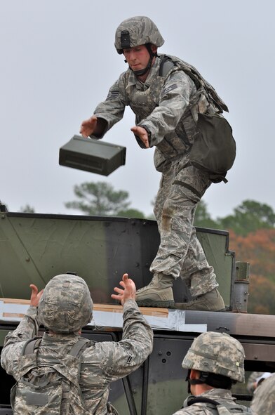 CAMP MINDEN, La. -- Security forces Airmen from the 5th Bomb Wing competed against other Air Force Global Strike Command security forces teams in the second annual Global Strike Challenge here, Nov. 5-7. Here, 5th Security Forces Squadron Airmen complete the ammunition canister movement phase of the competition. Each team was judged on completing various tasks during the competition to include their knowledge of tactical maneuvers as a team and as individuals, weapons familiarity, and overall job knowledge. (U.S. Air Force photo/ Airman 1st Class Jessica McConnell)