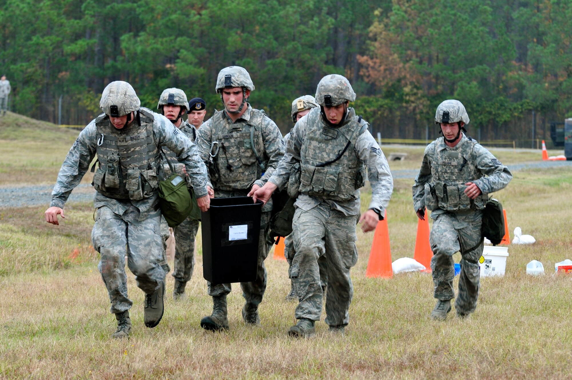 CAMP MINDEN, La. -- Security forces Airmen from the 5th Bomb Wing competed against other Air Force Global Strike Command security forces teams in the second annual Global Strike Challenge here, Nov. 5-7. Here, 5th Security Forces Squadron Airmen complete the water movement phase of the competition. Each team was judged on completing various tasks during the competition to include their knowledge of tactical maneuvers as a team and as individuals, weapons familiarity, and overall job knowledge. (U.S. Air Force photo/ Airman 1st Class Jessica McConnell)