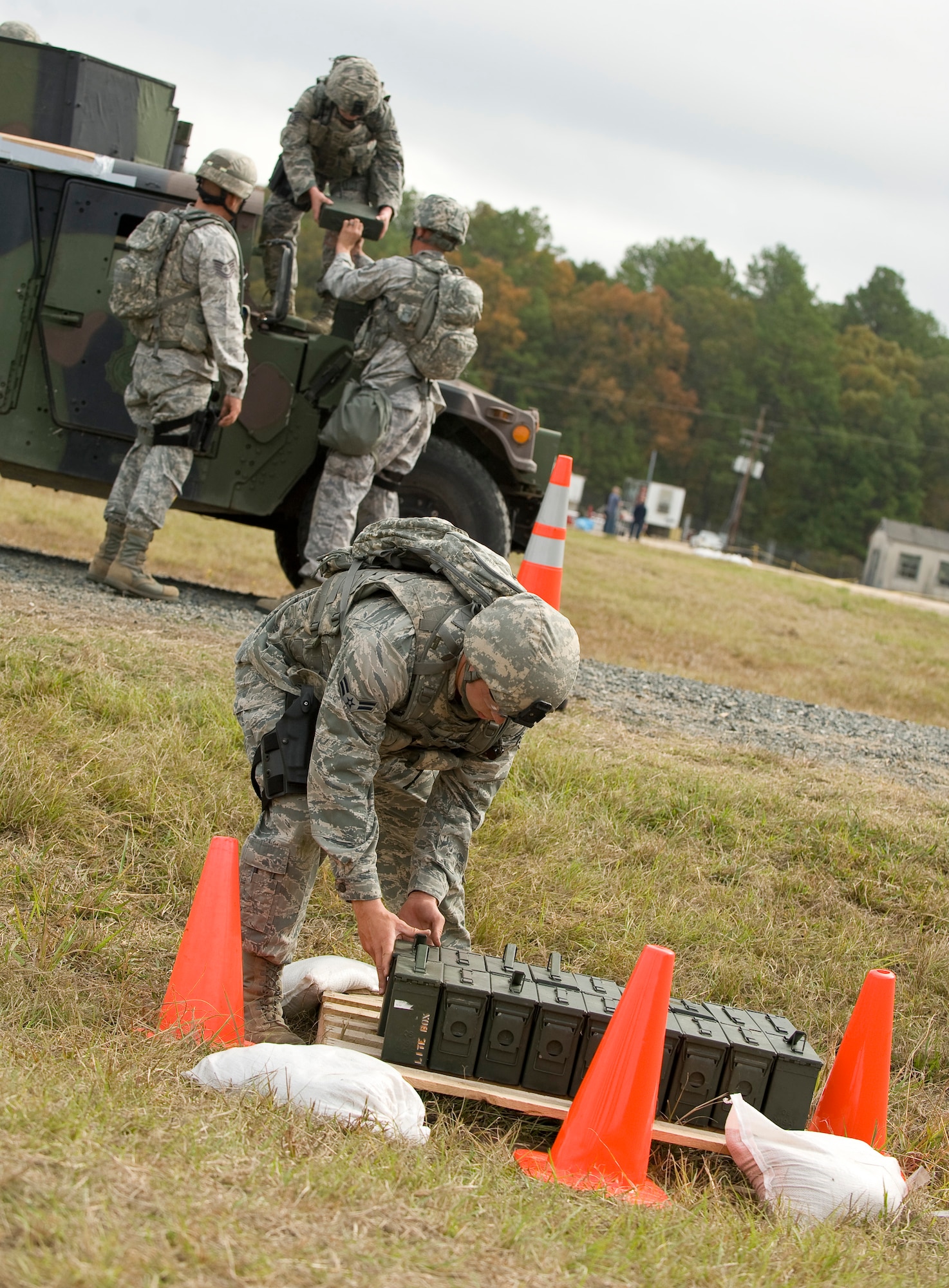 Members of the 7th Security Forces Squadron move ammo cans during the mental and physical challenge portion of the 2011 Air Force Global Strike Challenge on Camp Minden, La., Nov. 7. This was one of several events each security forces team had to complete during the MAP challenge. (U.S. Air Force photo/Senior Airman Chad Warren)(RELEASED)