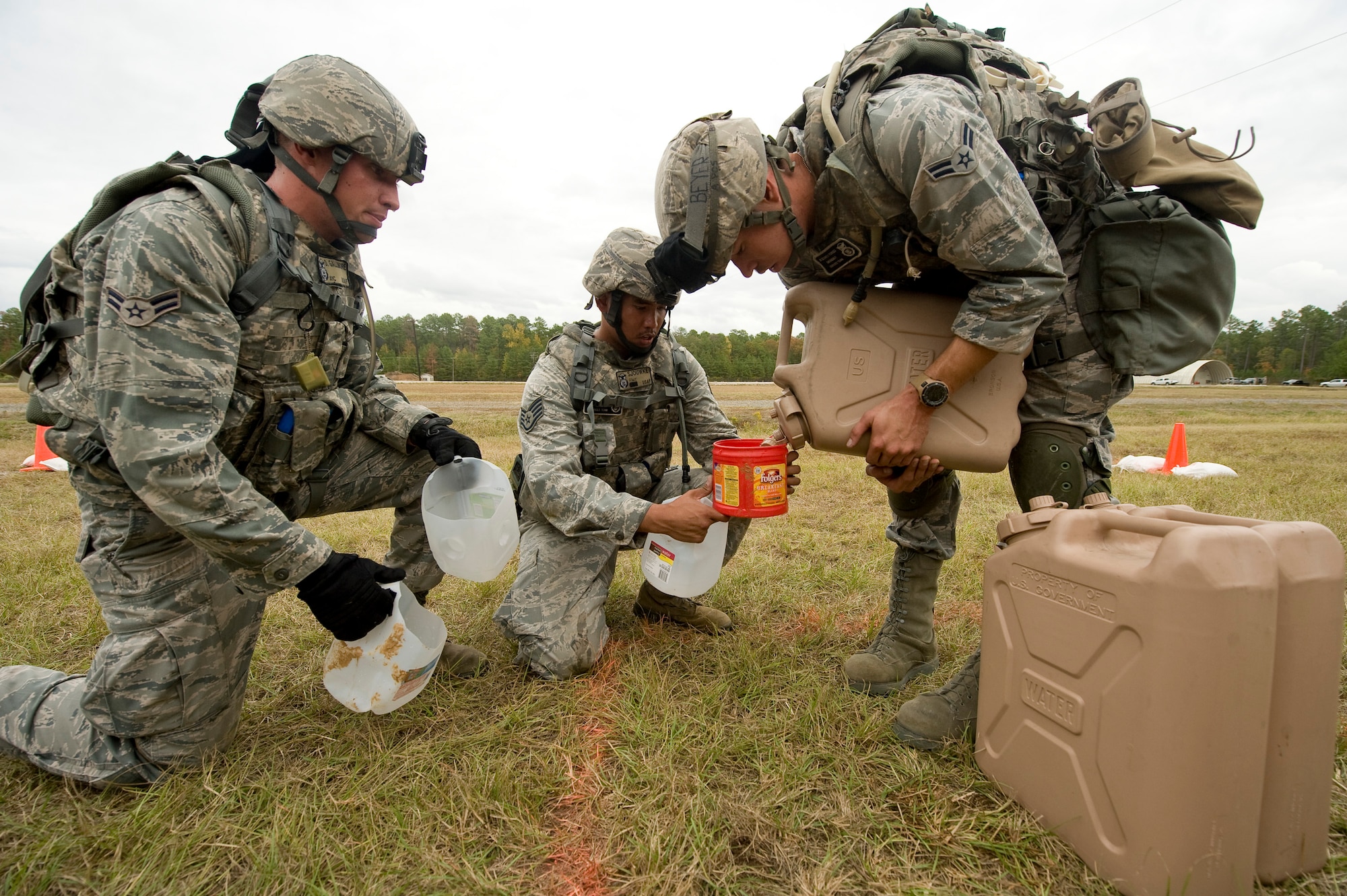 Members of the 2nd Security Forces Squadron measure water during the mental and physical challenge portion of the 2011 Air Force Global Strike Command challenge on Camp Minden, La., Nov. 7. The purpose of Global Strike Challenge is to build a culture of excellence and esprit de corps as we recognize the ?best of the best? in the Command. (U.S. Air Force photo/Senior Airman Chad Warren)(RELEASED)