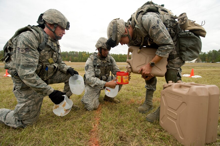 Members of the 2nd Security Forces Squadron measure water during the mental and physical challenge portion of the 2011 Air Force Global Strike Command challenge on Camp Minden, La., Nov. 7. The purpose of Global Strike Challenge is to build a culture of excellence and esprit de corps as we recognize the ?best of the best? in the Command. (U.S. Air Force photo/Senior Airman Chad Warren)(RELEASED)
