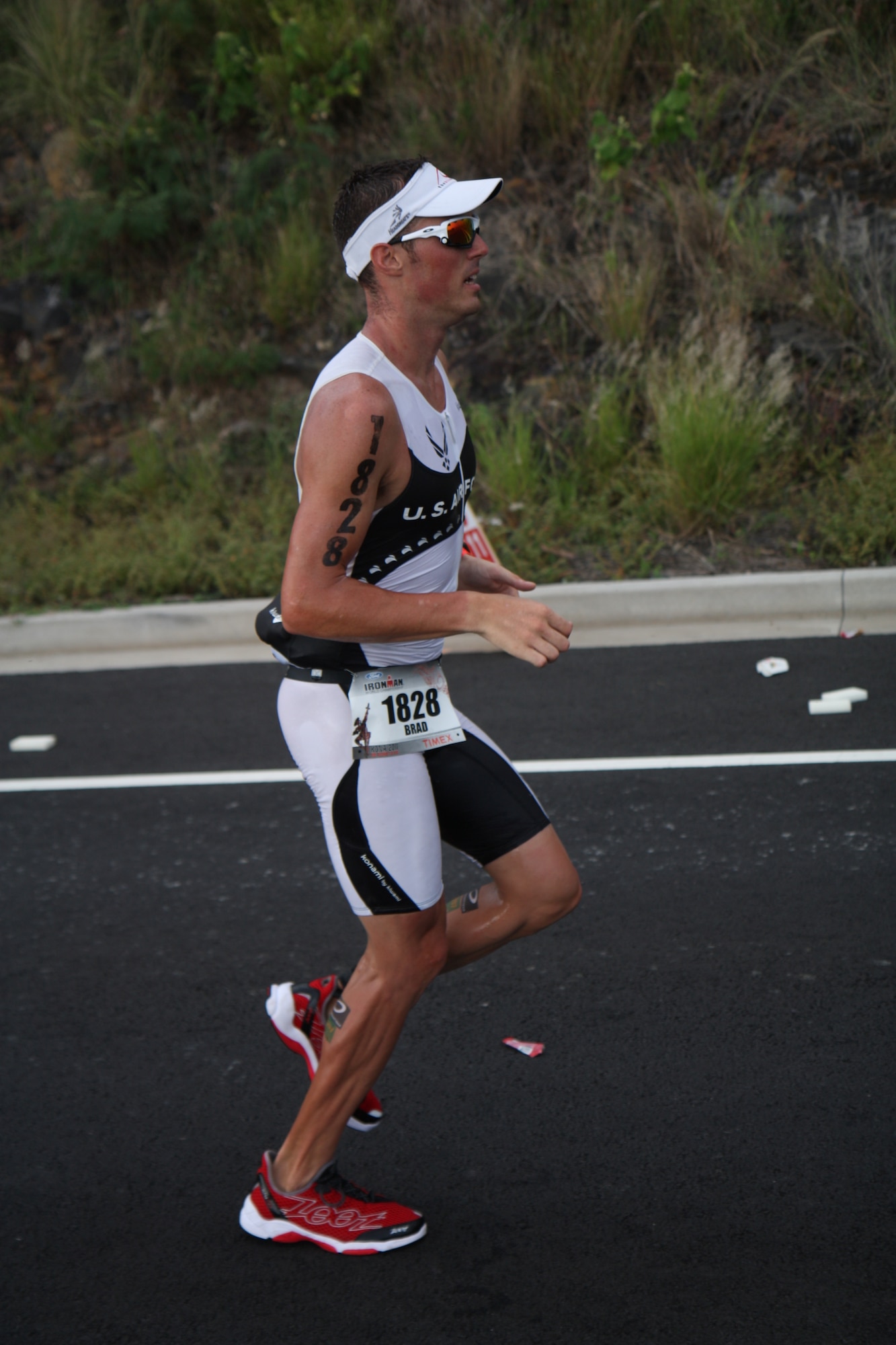 Staff Sgt. Bradley Williams, 51st Maintenance Operations Squadron senior weapons coordinator,reaches the last 2.5 miles stretch of the 2011 Ford IRONMAN Championship in Kailua-Kona, Hawaii. Williams finished 32nd in the 25 to 29 age bracket with an official time of 9 hours 36 minutes and 39 seconds. (U.S. Air Force photo/Capt. Ryan Young)