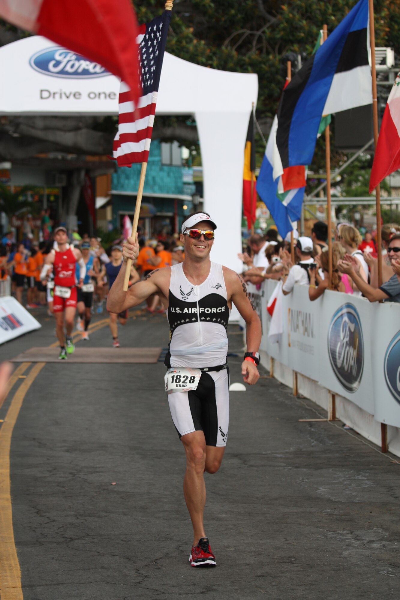 Staff Sgt. Bradley Williams, 51st Maintenance Operations Squadron senior weapons coordinator, finishes the last of the 26.2 miles run during the 2011 Ford IRONMAN Championship in Kailua-Kona, Hawaii Oct. 8, 2011. Williams finished 225th out of nearly 1,800 competitors from around the world in the 140.4 mile IRONMAN challenge. (U.S. Air Force photo/Capt. Ryan Young)