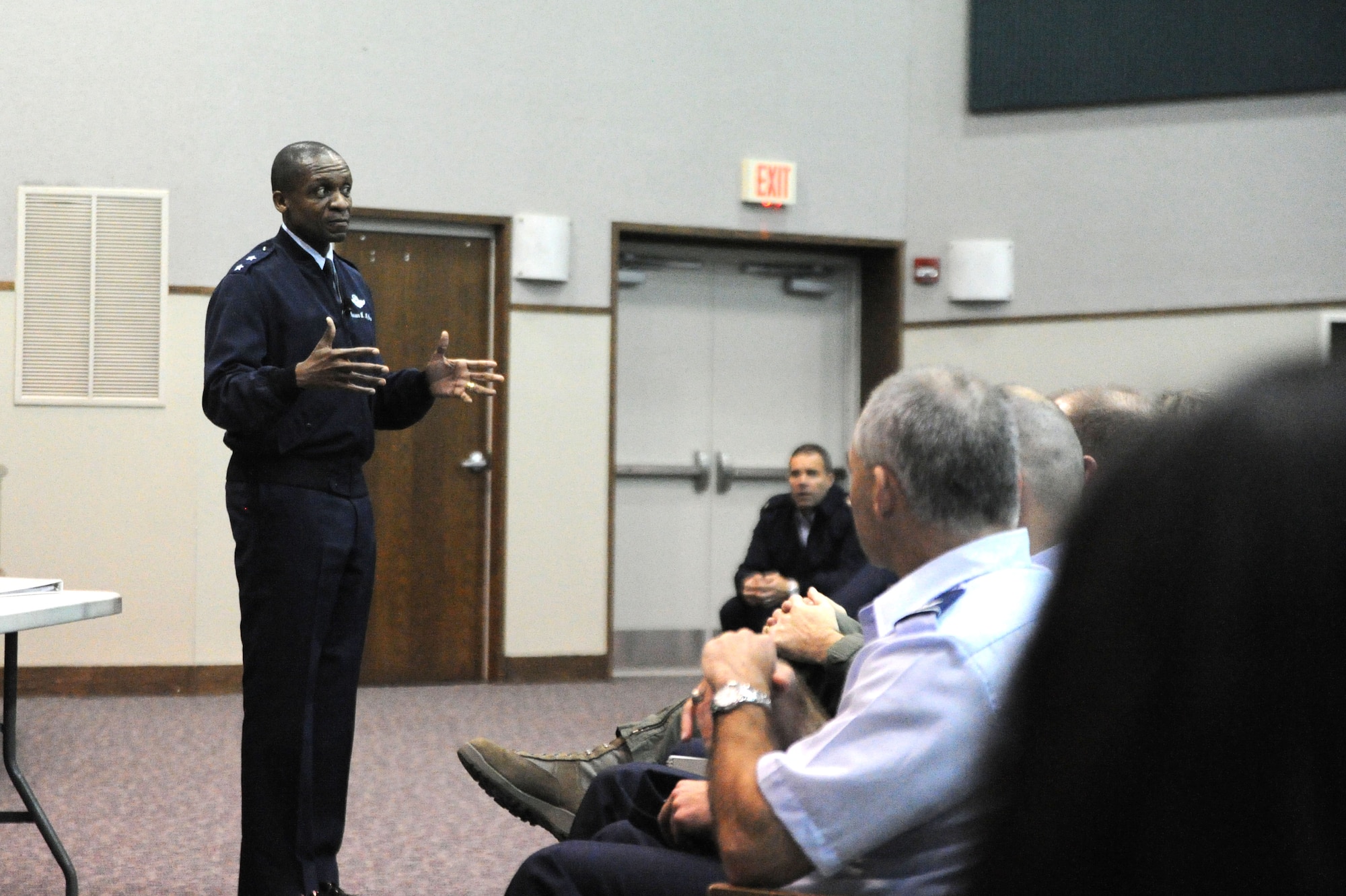 Air Force District of Washington Commander Maj. Gen. Darren McDew addressed his command Nov. 2, 2011 on Joint Base Andrews, Md., at the first of four town hall meetings to discuss Air Force-wide restructuring. The general also reminded the audience that while announcing the 4,500 job reductions, the Air Force also announced the addition of 5,900 positions in higher-priority areas like weapons buying, nuclear weapons management and the expanding field of intelligence, surveillance and reconnaissance.