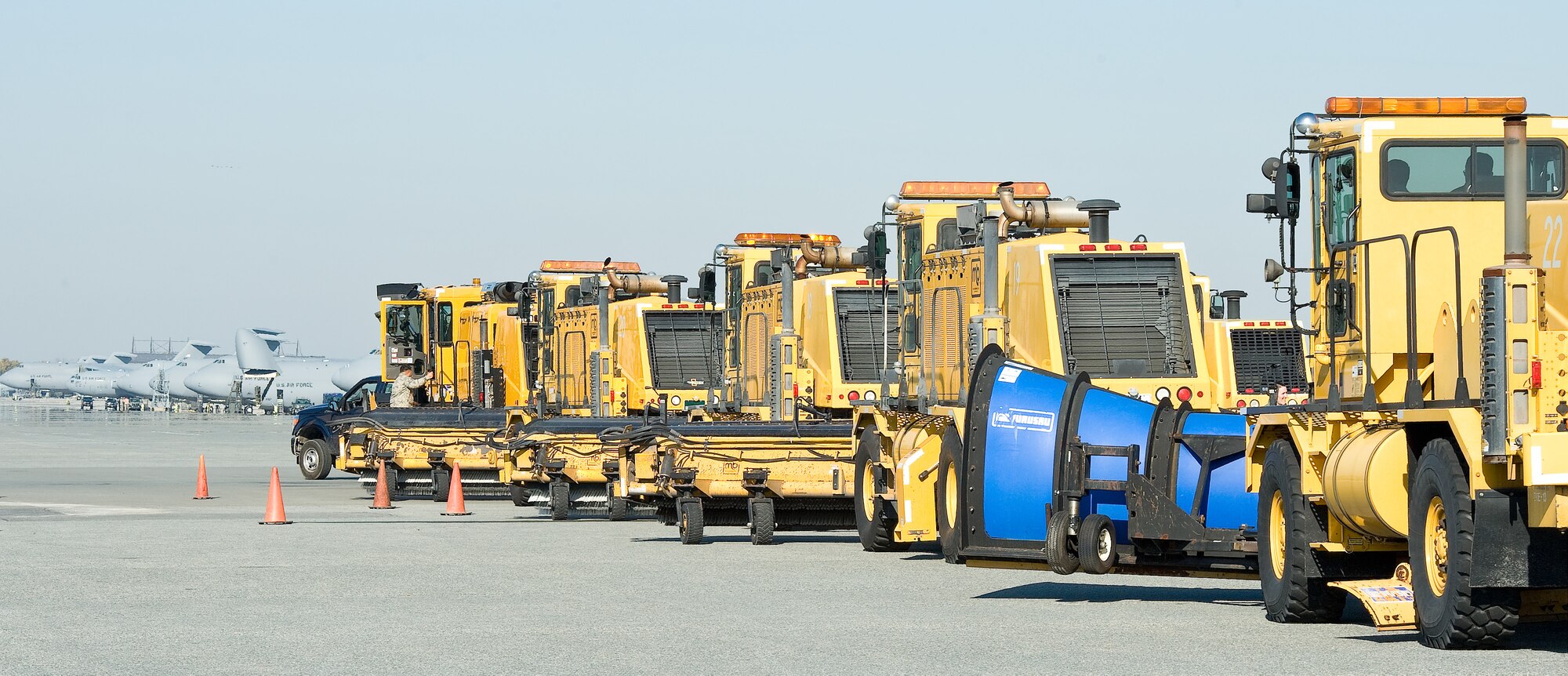 Col. Mark Camerer, commander of the 436th Airlift Wing, leads the procession of snow removal equipment down the flightline Nov. 2, 2011, at Dover Air Force Base, Del. The 436th Civil Engineer Squadron hosted this annual event, allowing commanders the opportunity to ride or drive.  (U.S. Air Force photo by Roland Balik)