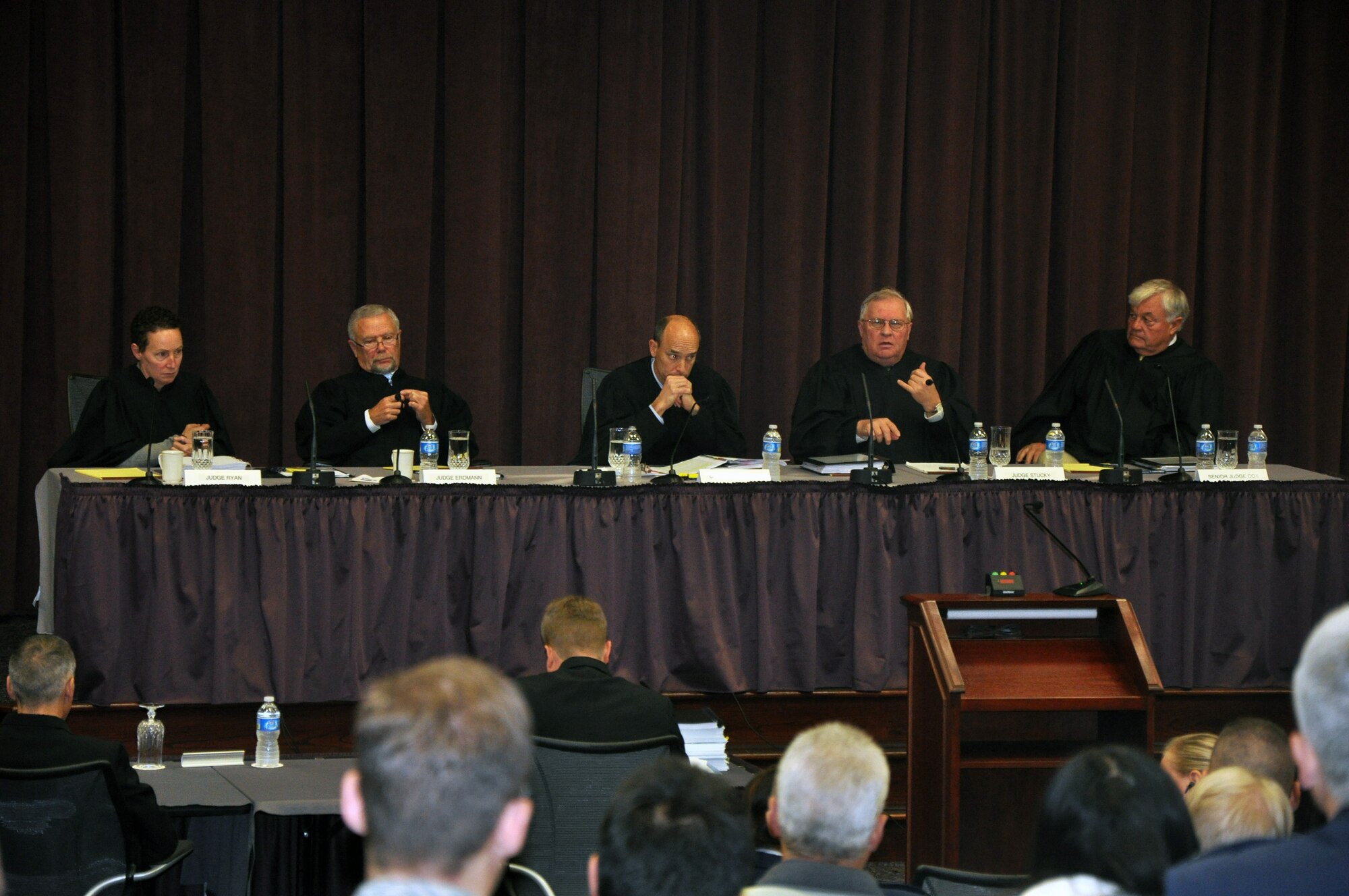 Five judges from the U.S. Court of Appeals for the Armed Forces participate in a question and answer session in the Global Reach Planning Center on Nov. 3, 2011, at Scott Air Force Base, Ill. From left they include: Judge Margaret A. Ryan, Judge Charles E. Erdmann, Chief Judge James E. Baker, Judge Scott W. Stucky and former Senior Judge Walter T. Cox III. The U.S. Court of Appeals for the Armed Forces, as part of a "project outreach," held a hearing at Scott AFB on an actual case. After ajournment, they held a question and answer period for the audience of more than 100 people to learn more about the U.S. Court of Appeals for the Armed Forces. The court normally operates in Washington, D.C., and were hosted at Scott AFB by the Headquarters Air Mobility Command Judge Advocate office and the 375th Air Mobility Wing legal office. (U.S. Air Force Photo/Master Sgt. Scott T. Sturkol)