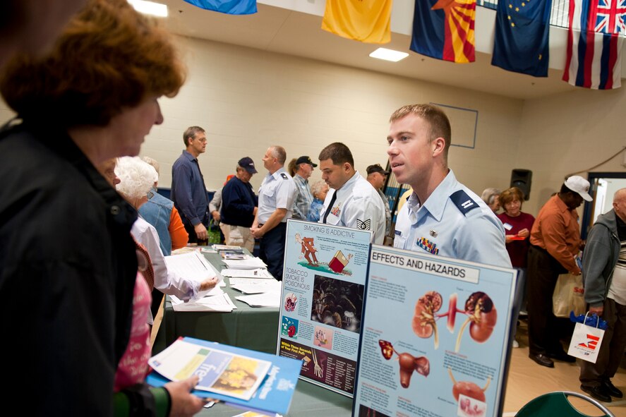 U.S. Air Force Capt. Zach Garrett, 23rd Aerospace Medicine Squadron Health and Wellness Center flight commander, provides preventive medicine information during Retiree Appreciation Day at Moody Air Force Base, Ga., Nov. 5, 2011. Garrett spoke with retirees and their families about habits that can prevent diseases before the need to treat symptoms. (U.S. Air Force photo by Staff Sgt. Jamal D. Sutter/Released) 