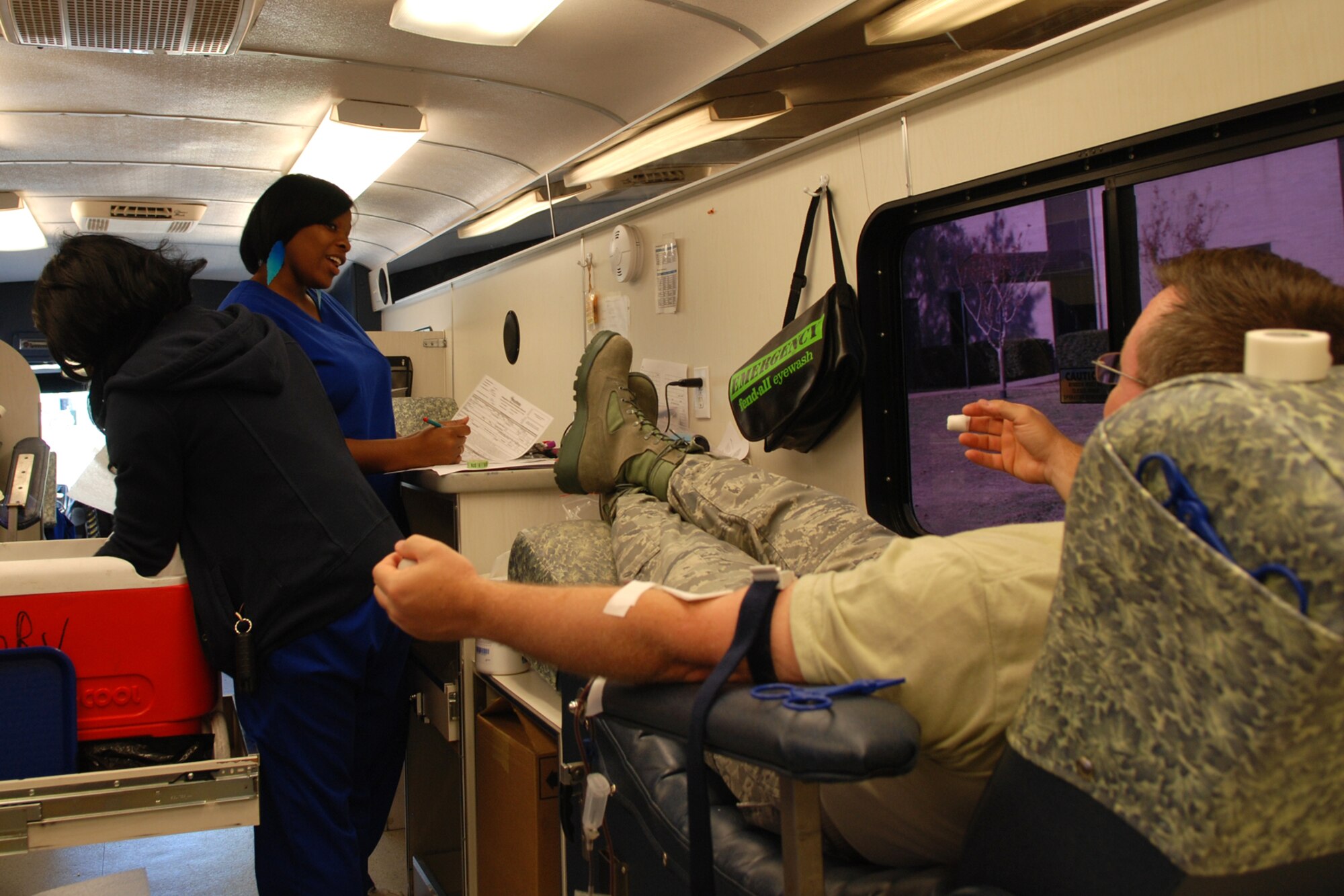 Ebony Small, a phlobotomist with Life Share Blood Center, prepares paperwork on an Airman from the 307th Bomb Wing during a blood drive at Barksdale Air Force Base, La., Nov. 5, 2011.  The wing regularly sponsors drives to help blood banks Bossier City and Shreveport. Airmen from the wing take time from their busy unit training assembly schedule to support this effort. (U.S. Air Force photo by Staff Sgt. Theodore Daigle/Released)