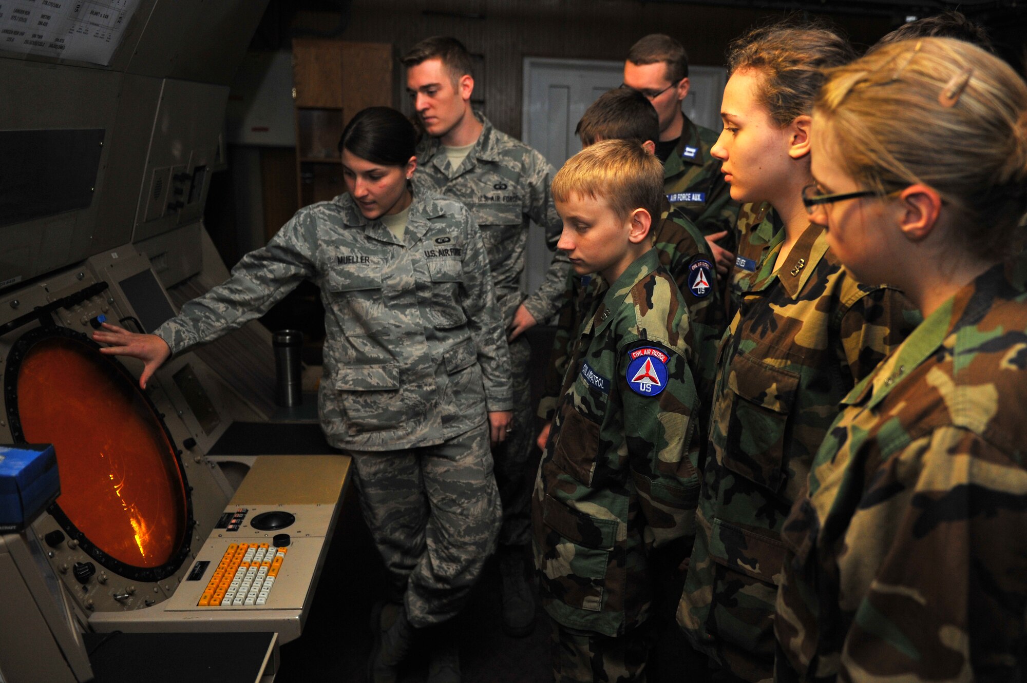 SPANGDAHLEM AIR BASE, Germany – Senior Airman Laura Mueller, 52nd Operations Support Squadron ground controller, explains the functions and uses for air space radar scopes to visiting Spangdahlem Civil Air Patrol cadets here Nov. 3. The cadets visited the control tower and ground radar office to get an inside look into the daily operations and jobs of the U.S. Air Force. CAP helps teenagers ages 12 to 19 push themselves to progress through a 16-step program that includes aerospace education, leadership training, physical fitness and moral leadership. (U.S. Air Force photo/Airman 1st Class Dillon Davis)