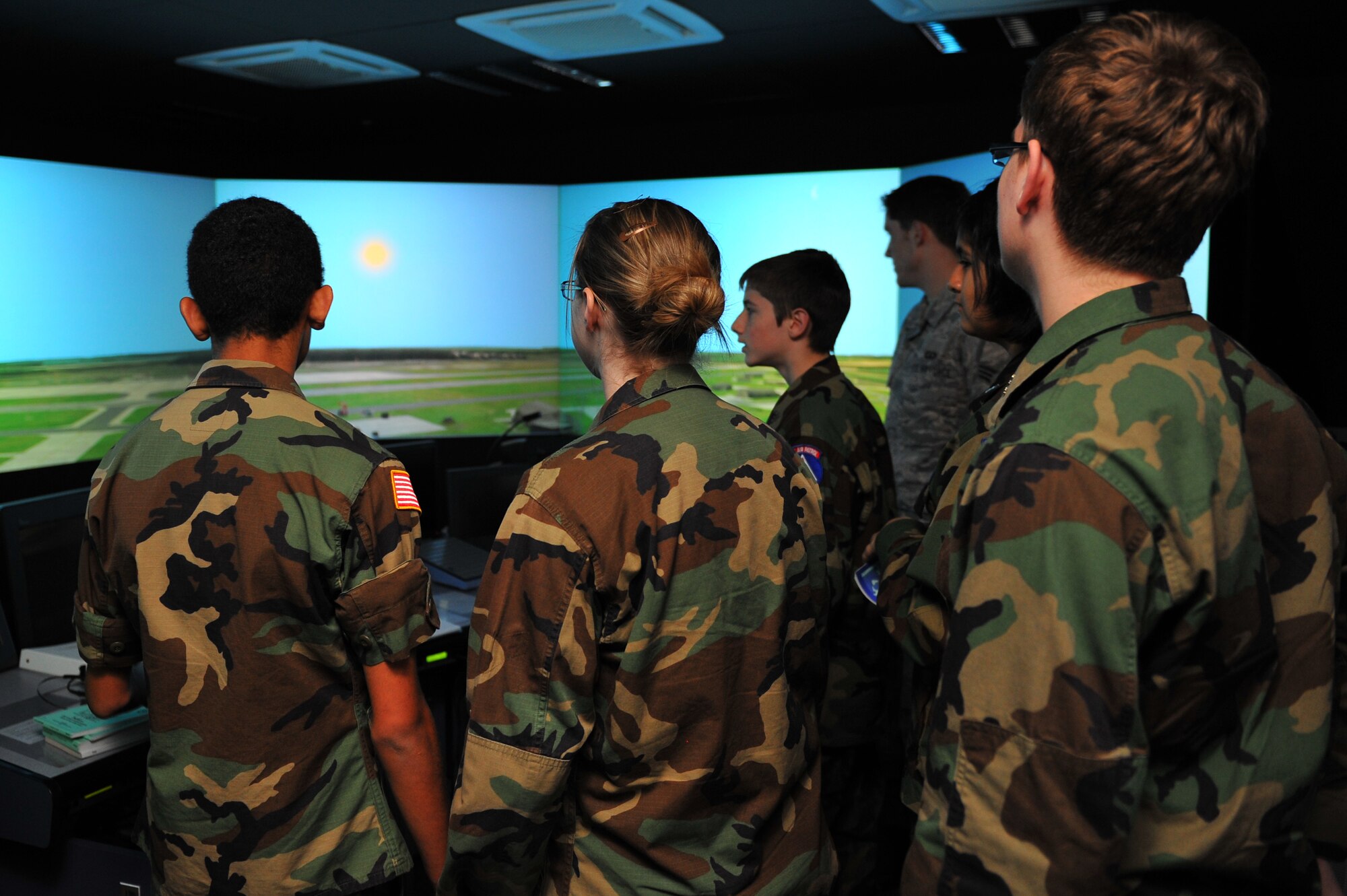 SPANGDAHLEM AIR BASE, Germany – Spangdahlem Civil Air Patrol cadets watch a demonstration of how the 52nd Operations Support Squadron control tower simulator trains new controllers to manage flightline airspace here Nov. 3. The cadets visited the control tower and ground radar office to get an inside look into the daily operations and jobs of the U.S. Air Force. CAP helps teenagers ages 12 to 19 push themselves to progress through a 16-step program that includes aerospace education, leadership training, physical fitness and moral leadership. (U.S. Air Force photo/Airman 1st Class Dillon Davis)