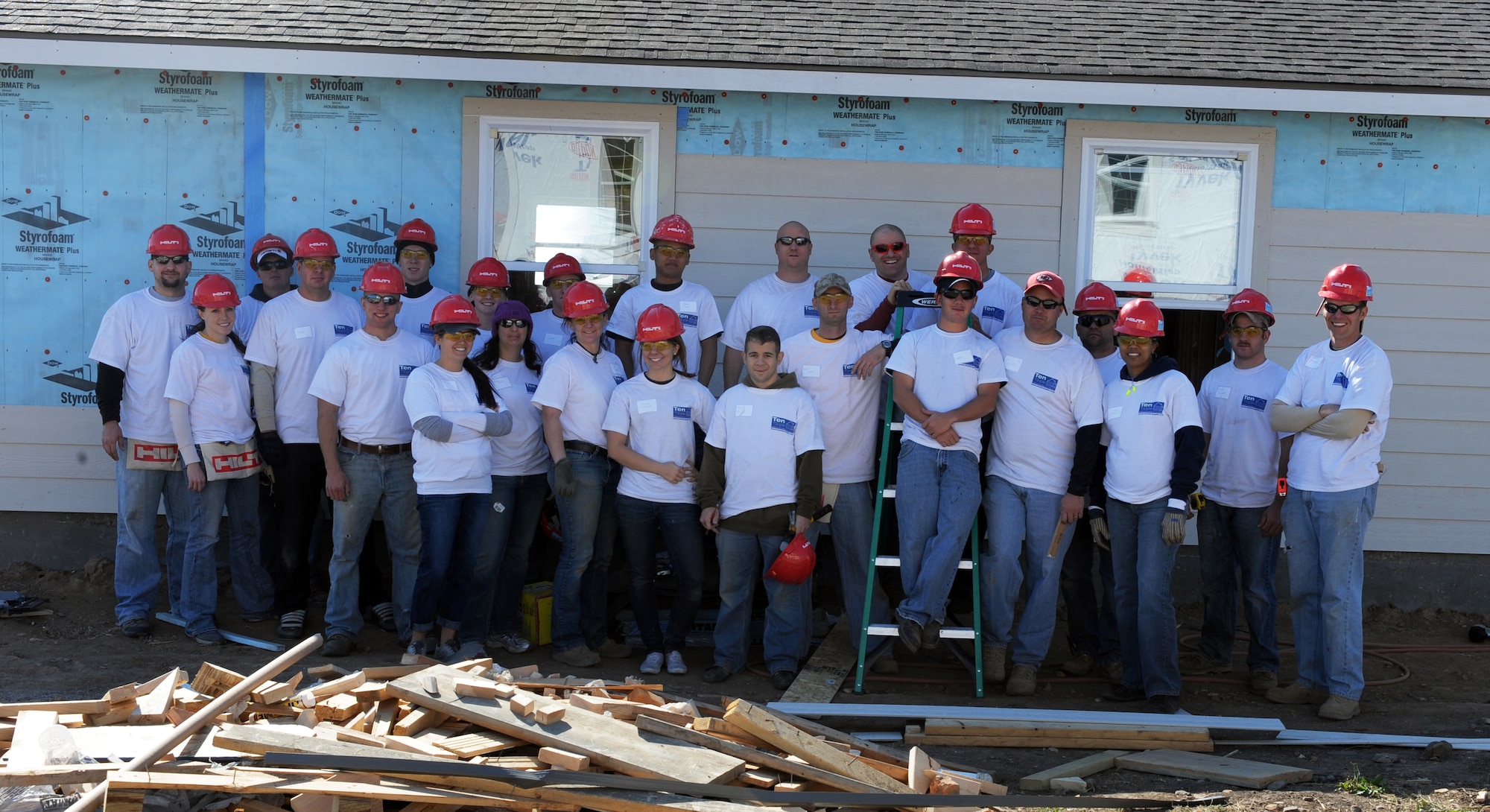 JOPLIN, Mo. -- Airmen assigned to the 509th Civil Engineer Squadron at Whiteman Air Force Base pose for a group photo while they volunteered with Habitat for Humanity to build 10 homes in 10 days for the residents who lost their homes in a tornado that reaped over three billion dollars in damages to the city. (U.S. Air Force photo/Senior Airman Laura Goodgame)