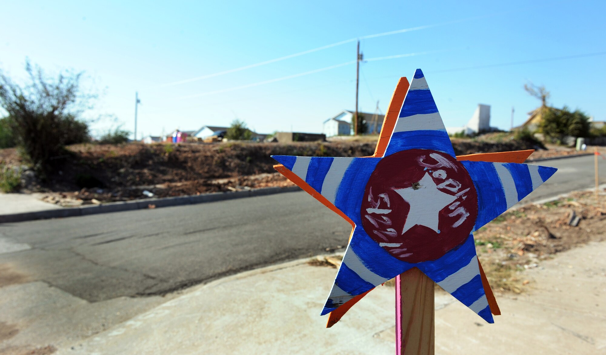 JOPLIN, Mo. --A star is seen on every corner between 20th and 26th street as a glimmer of hope in one of the hardest hit areas by the May 22 tornado that struck Joplin. Airmen assigned to the 509th Civil Engineer Squadron at Whiteman Air Force Base volunteered with Habitat for Humanity to build 10 homes in 10 days for the residents that lost their homes. (U.S. Air Force photo/Senior Airman Laura Goodgame)