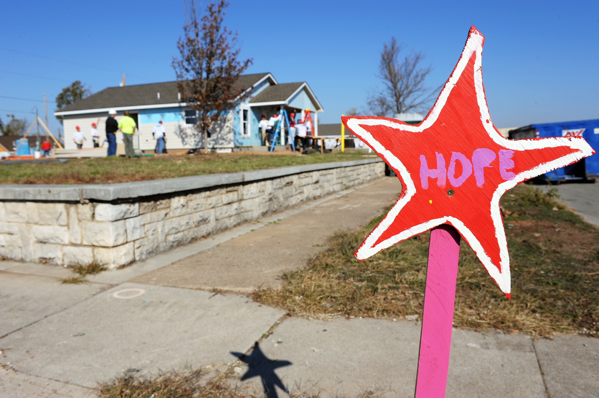 JOPLIN, Mo. --A star is seen on every corner between 20th and 26th street as a glimmer of hope in one of the hardest hit areas by the May 22 tornado that struck Joplin. Airmen assigned to the 509th Civil Engineer Squadron at Whiteman Air Force Base volunteered with Habitat for Humanity to build 10 homes in 10 days for the residents that lost their homes. (U.S. Air Force photo/Senior Airman Laura Goodgame)