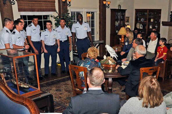 The cadet a cappella singing group "In the Stairwell" performs at the visiting faculty reception in the home of Brig. Gen. Dana Born at the Air Force Academy Oct. 27, 2011. Born is the Academy's dean of the faculty. (U.S. Air Force photo/Sarah Chambers)