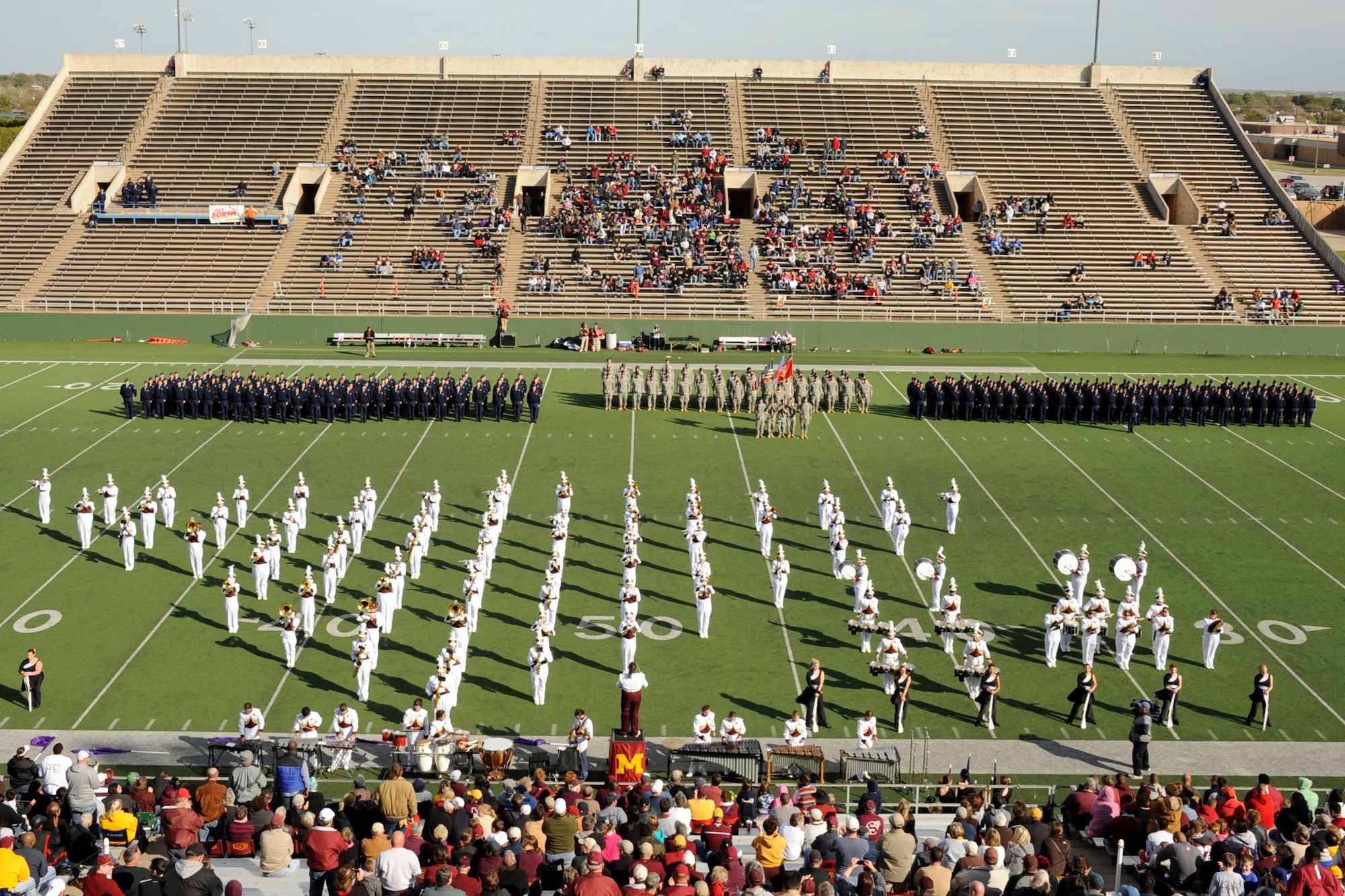 Sheppard Airmen participate in the half-time show during Midwestern State University’s military appreciation tribute at Memorial Stadium, Wichita Falls, Texas, Nov. 5, 2011. Saturday’s game also included a T-6 Texan II flyover by the 80th Flying Training Wing and a presentation to Sheppard and Fort Sill commanders. (U.S. Air Force photo/Danny Webb)
