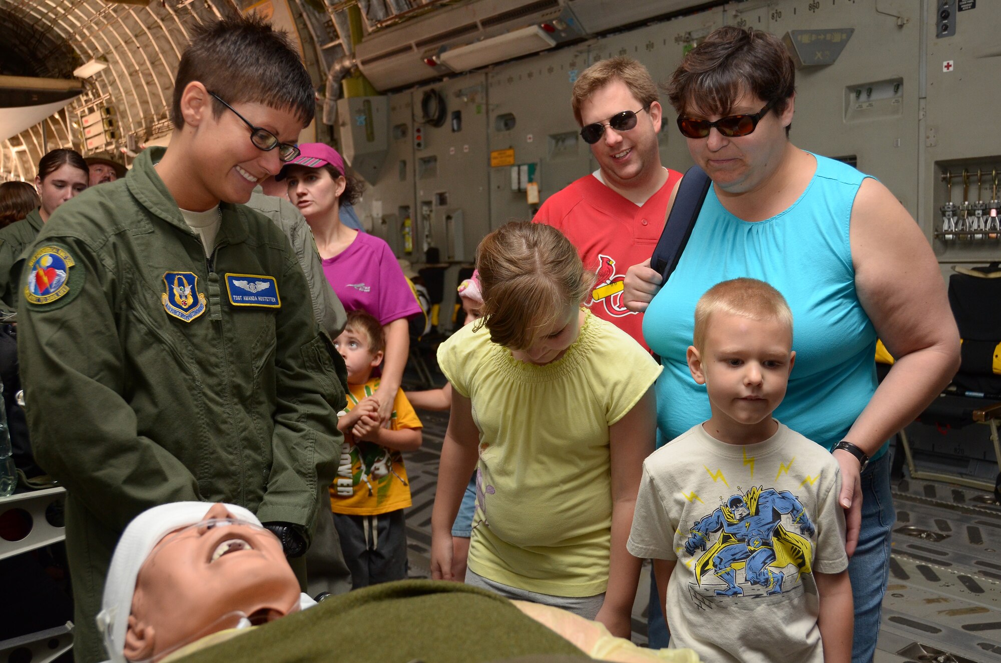 WRIGHT-PATTERSON AIR FORCE BASE, Ohio - Tech. Sgt. Amanda Hostetter, 445th Aeromedical Evacuation Squadron, interacts with visitors aboard a 445th Airlift Wing C-17 Globemaster III during the 2011 Air Show & Lifestyle Expo at Waterkloof Air Force Base, South Africa, Oct. 1. (U.S. Air Force photo/Senior Airman Mikhail Berlin)