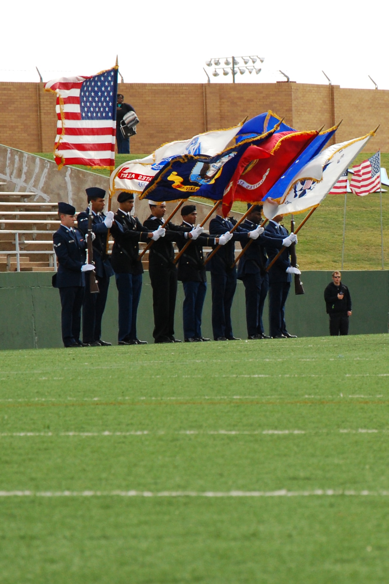 The Sheppard Air Force Base Honor Guard presents the colors during Midwestern State University’s military appreciation football game at Memorial Stadium, Wichita Falls, Texas, Nov. 5, 2011. Saturday’s game included a T-6 Texan II flyover by the 80th Flying Training Wing, a presentation to Sheppard and Fort Sill commanders, and the inclusion of a formation of Airmen and Soldiers in the half time show. (U.S. Air Force photo/Capt. Brittany Martin)