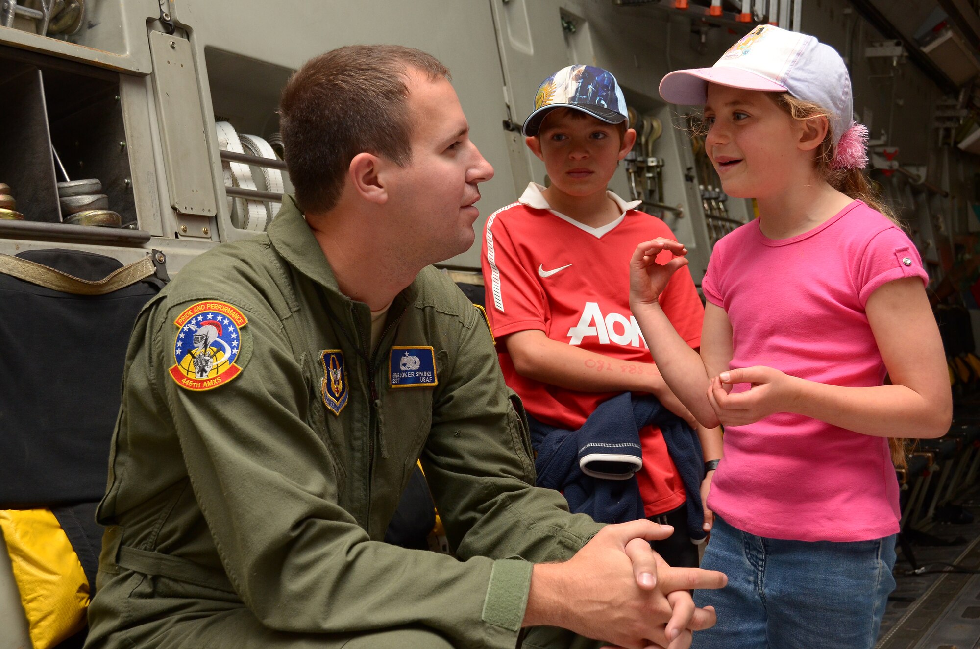 WRIGHT-PATTERSON AIR FORCE BASE, Ohio - Staff Sgt. Greg Sparks, 445th Aircraft Maintenance Squadron, talks to South African air show attendees about his role as a crew chief on the C-17 Globemaster III. (U.S. Air Force photo/Senior Airman Mikhail Berlin)