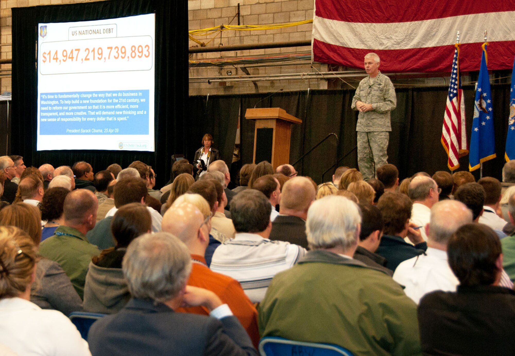 HANSCOM AIR FORCE BASE, Mass. - Electronic Systems Center Commander Lt. Gen. CR Davis addresses employees packed into the Hanscom Aero Club Hangar during his Commander’s Call Nov. 3. The general discussed organizational changes and staff reductions related to Air Force service consolidation efforts and Air Force Materiel Command restructuring (see related stories). He also spoke about a vision for the work now performed by the center and laid out his commander’s intent, which included: attacking challenges, being the provider of choice for capabilities within the center’s mission areas; operating as a single enterprise; working with warfighters to produce smaller, more executable requirements; and employees caring for one another during potentially stressful times ahead. (U.S. Air Force photo)