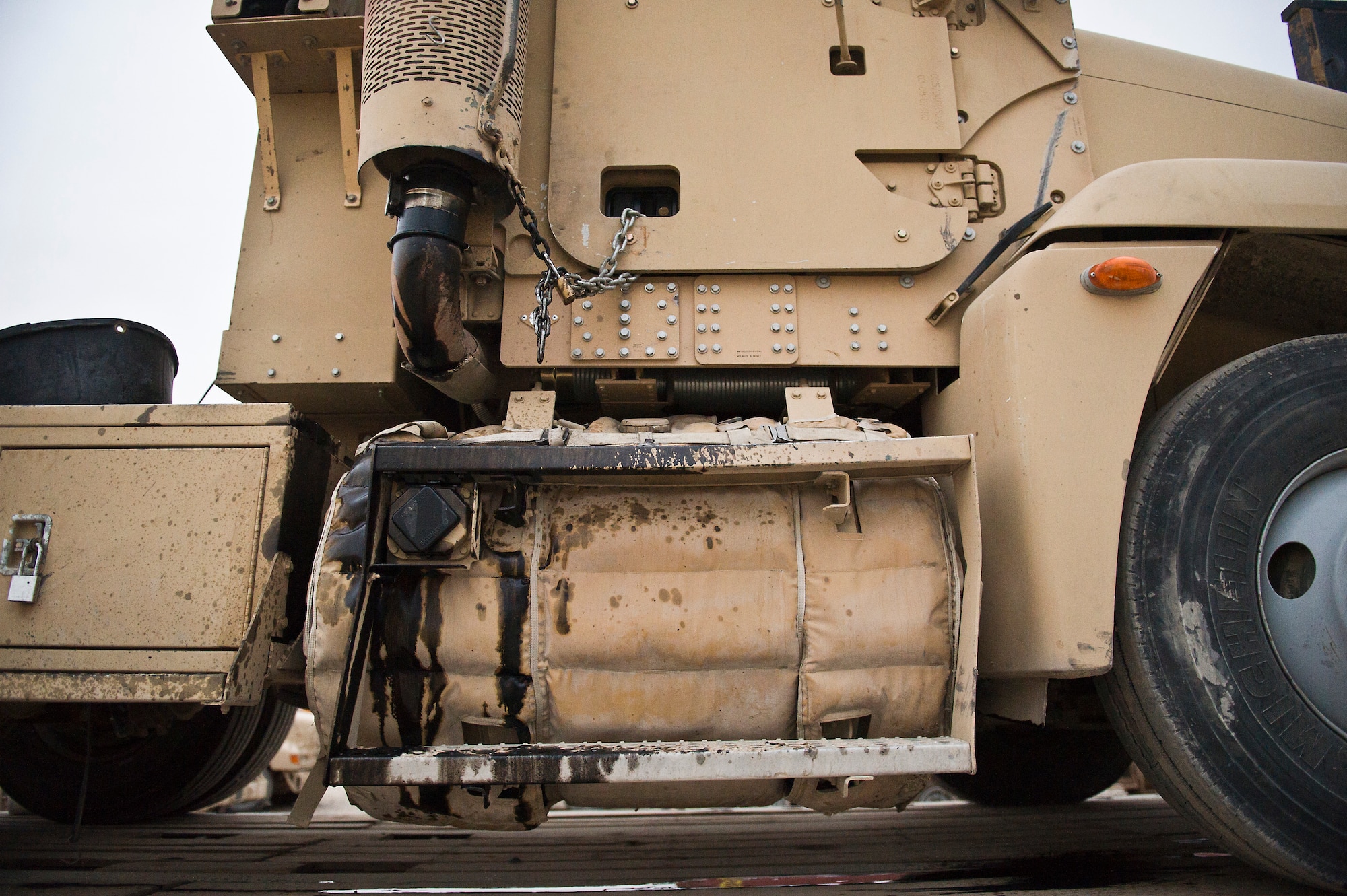 A U.S. Air Force M915 truck from the 70th medium truck detachment is covered with oil after a turbo charger malfunctioned during a convoy in Iraq on Oct. 26, 2011. Because the truck broke down in a high threat area in Iraq, it was towed to Joint Base Balad, Iraq and then loaded onto a trailer for transport back to the 70th MTD. (U.S. Air Force Photo/Master Sgt. Jeffrey Allen)