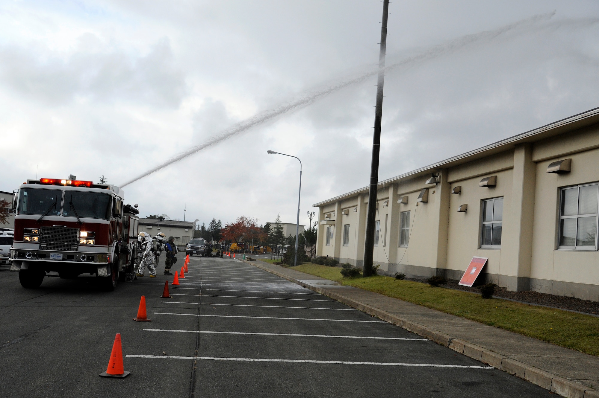MISAWA AIR BASE, Japan - The 35th Civil Engineer Squadron’s fire department responds to a mock fire after a simulated attack during an operational readiness exercise here Nov. 7. The 35th Fighter Wing is taking part in an ORE in preparation for inspection next month. (U.S. Air Force photo/Tech. Sgt. Marie Brown) 