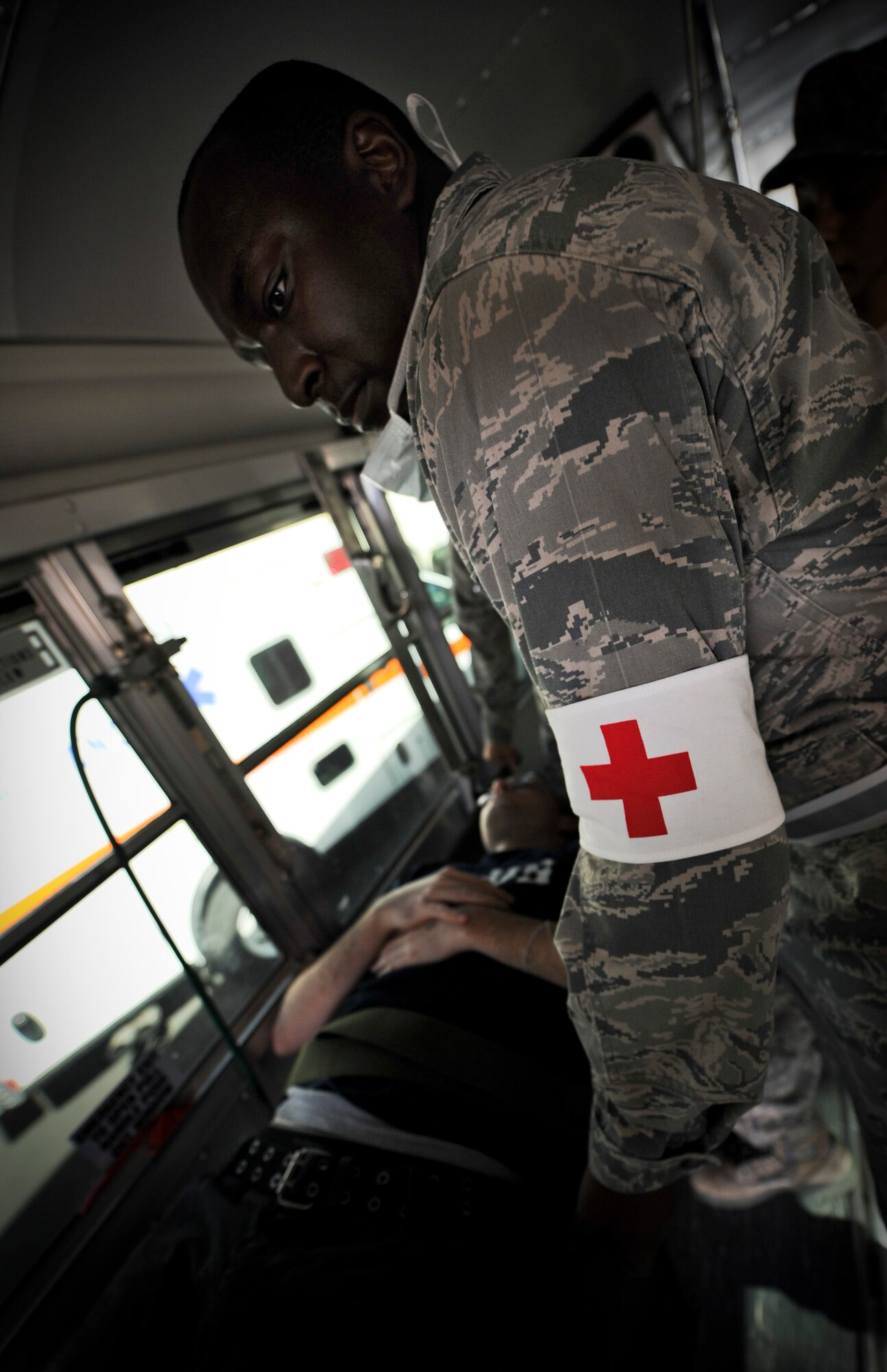 YOKOTA AIR BASE, Japan -- Airmen from the 374th Medical Operations Squadron load a wounded victim on a bus to transport to the hospital during an operational readiness exercise at Yokota Air Base, Japan, Nov. 7, 2011. The ORE tests Airmen's knowledge and ability in a variety of areas in both the peacetime and wartime mission. (U.S. Air Force photo/Staff Sgt. Stacy Moless)