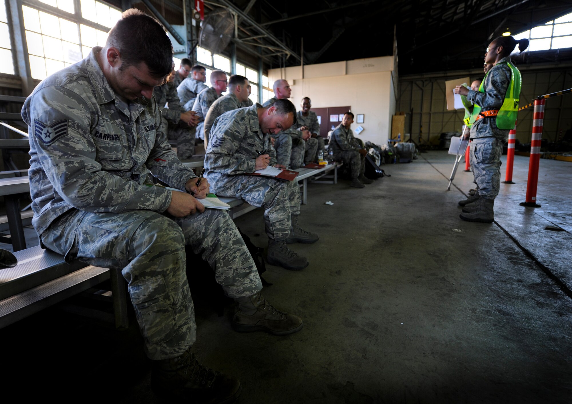 YOKOTA AIR BASE, Japan -- Members from the 374th Security Forces Squadron process through a deployment line during an operational readiness exercise at Yokota Air Base, Japan, Nov. 7, 2011. The ORE tests Airmen's knowledge and ability in a variety of areas in both the peacetime and wartime mission. (U.S. Air Force photo/Staff Sgt. Stacy Moless)