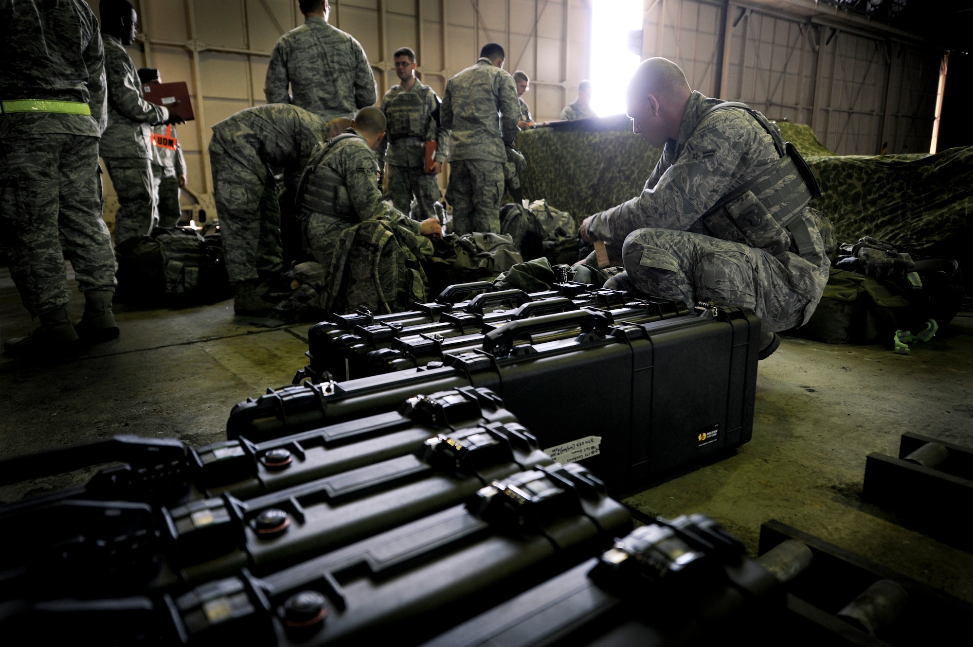 YOKOTA AIR BASE, Japan -- Members from the 374th Security Forces Squadron process through a deployment line during an operational readiness exercise at Yokota Air Base, Japan, Nov. 7, 2011. The ORE tests Airmen's knowledge and ability in a variety of areas in both the peacetime and wartime mission. (U.S. Air Force photo/Staff Sgt. Stacy Moless)