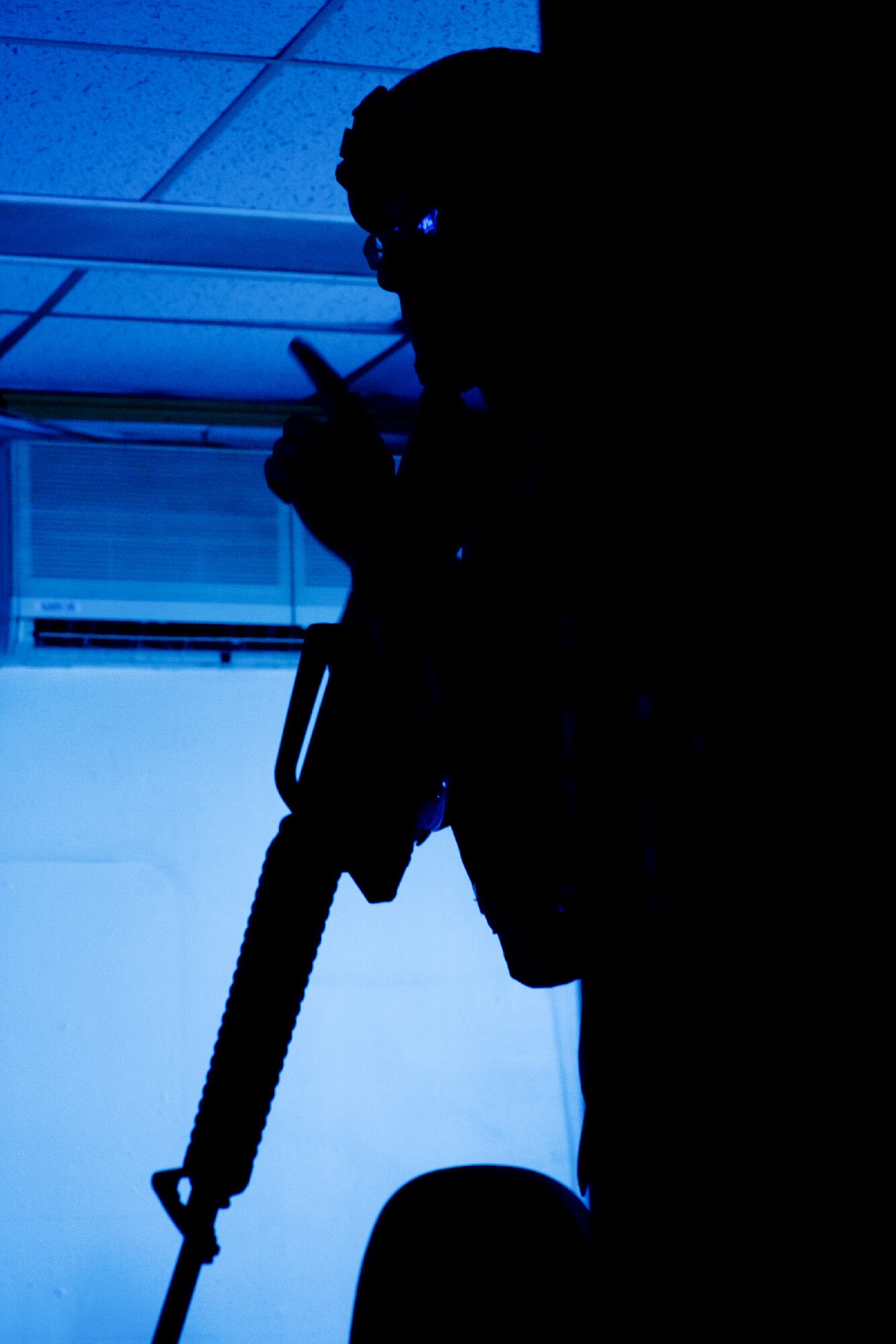 YOKOTA AIR BASE, Japan -- Staff Sgt. Rafael Quiroz, 374th Security Forces Squadron patrolman, watches his wingman's back during an active shooter scenario at Yokota Air Base, Japan, Nov. 7, 2011. Yokota is participating in a week-long exercise to maintain operational readiness capabilities. (U.S. Air Force photo/Osakabe Yasuo)