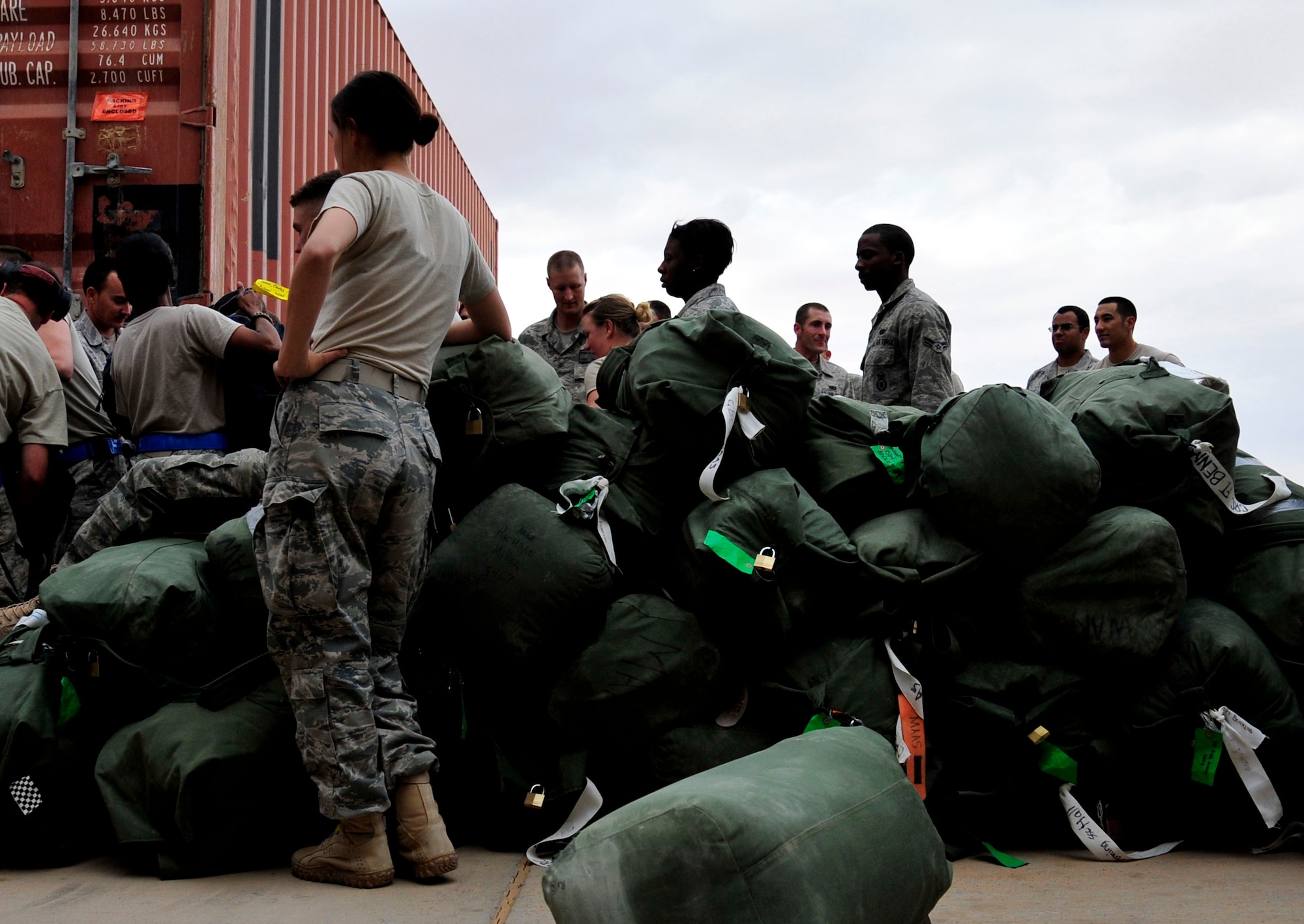 U.S. service members at Al Asad Air Base, Iraq, prepare for their flight to the U.S. on Nov. 1, 2011. The group was deployed in support of Operation New Dawn and helped create a more stable, sovereign and self-reliant Iraq. The U.S. military is on track to honor its commitment to the U.S.-Iraq Security Agreement and redeploy the remaining 33,000 troops by Dec. 31, 2011.  At the height of the surge in 2007, there were 165,000 U.S. troops in Iraq. This drawdown is one of the largest military operations since World War II.  (U.S. Air Force photo/Master Sgt. Cecilio Ricardo)