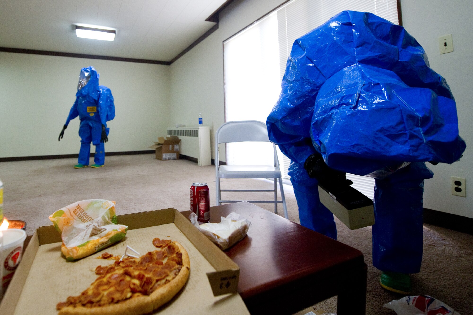 YOKOTA AIR BASE, Japan -- Airmen from the 374th Civil Engineer Squadron perform an initial response sweep during a medical counter-chemical, biological, radiological and nuclear exercise scenario at Yokota Air Base, Japan, Nov. 4, 2011. The training experience is valuable to Airmen because it tests their knowledge on how to identify and react to CBRN agents. (U.S. Air Force photo/Osakabe Yasuo)