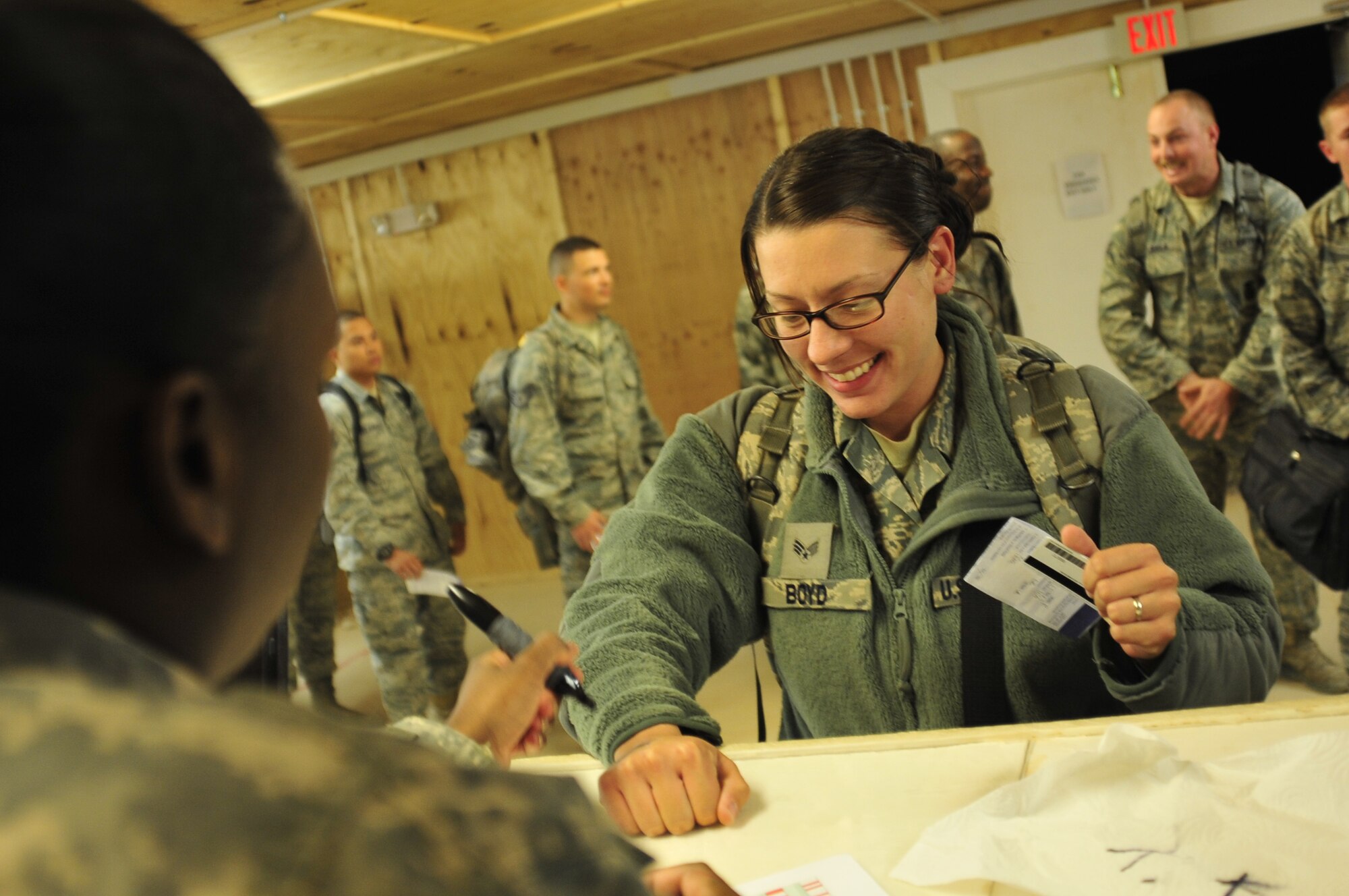 Senior Airman Amber Boyd, who was deployed with the 332nd Expeditionary Security Forces Squadron at Joint Base Balad, Iraq, clears customs at the Al Asad Air Base Passenger Terminal in Iraq prior to departing for the U.S. on Nov. 1, 2011. Airman Boyd is assigned to the 633rd Security Forces Squadron at Joint Base Langley-Eustis, Va. She deployed in support of Operation New Dawn and helped create a more stable, sovereign and self-reliant Iraq. The U.S. military is on track to honor its commitment to the U.S.-Iraq Security Agreement and redeploy the remaining 33,000 troops by Dec. 31, 2011.  At the height of the surge in 2007, there were 165,000 U.S. troops in Iraq. This drawdown is one of the largest military operations since World War II.   (U.S. Air Force photo/Master Sgt. Cecilio Ricardo)