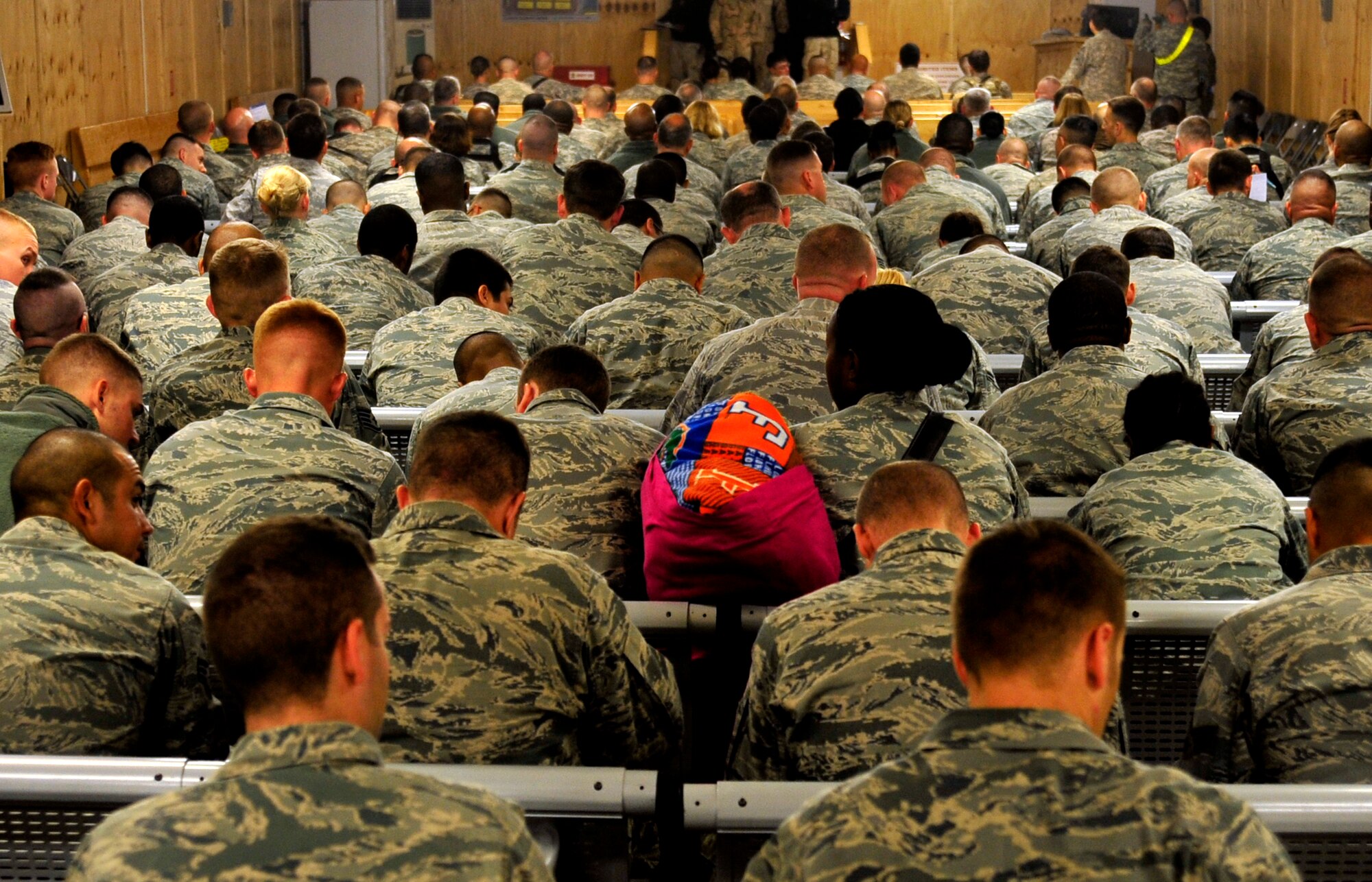 U.S. service members fill out paperwork at the Al Asad Air Base Passenger Terminal in Iraq to clear customs prior to departing for the U.S. on Nov. 1, 2011. The group was deployed in support of Operation New Dawn and helped create a more stable, sovereign and self-reliant Iraq. The U.S. military is on track to honor its commitment to the U.S.-Iraq Security Agreement and redeploy the remaining 33,000 troops by Dec. 31, 2011.  At the height of the surge in 2007, there were 165,000 U.S. troops in Iraq. This drawdown is one of the largest military operations since World War II.  (U.S. Air Force photo/Master Sgt. Cecilio Ricardo)
